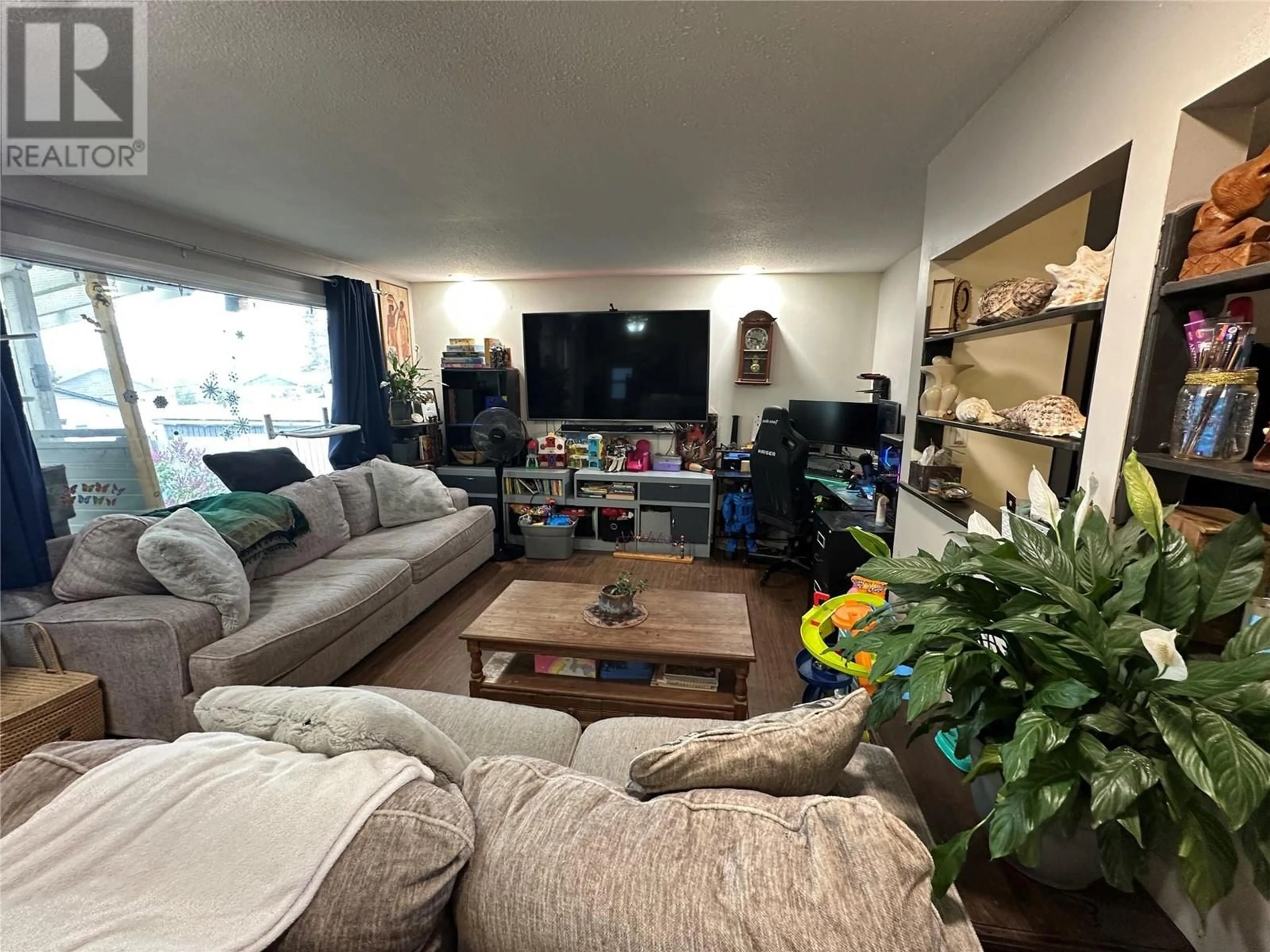Living room with furniture, unknown for 1517 95 AVENUE, Dawson Creek British Columbia V1G1J9