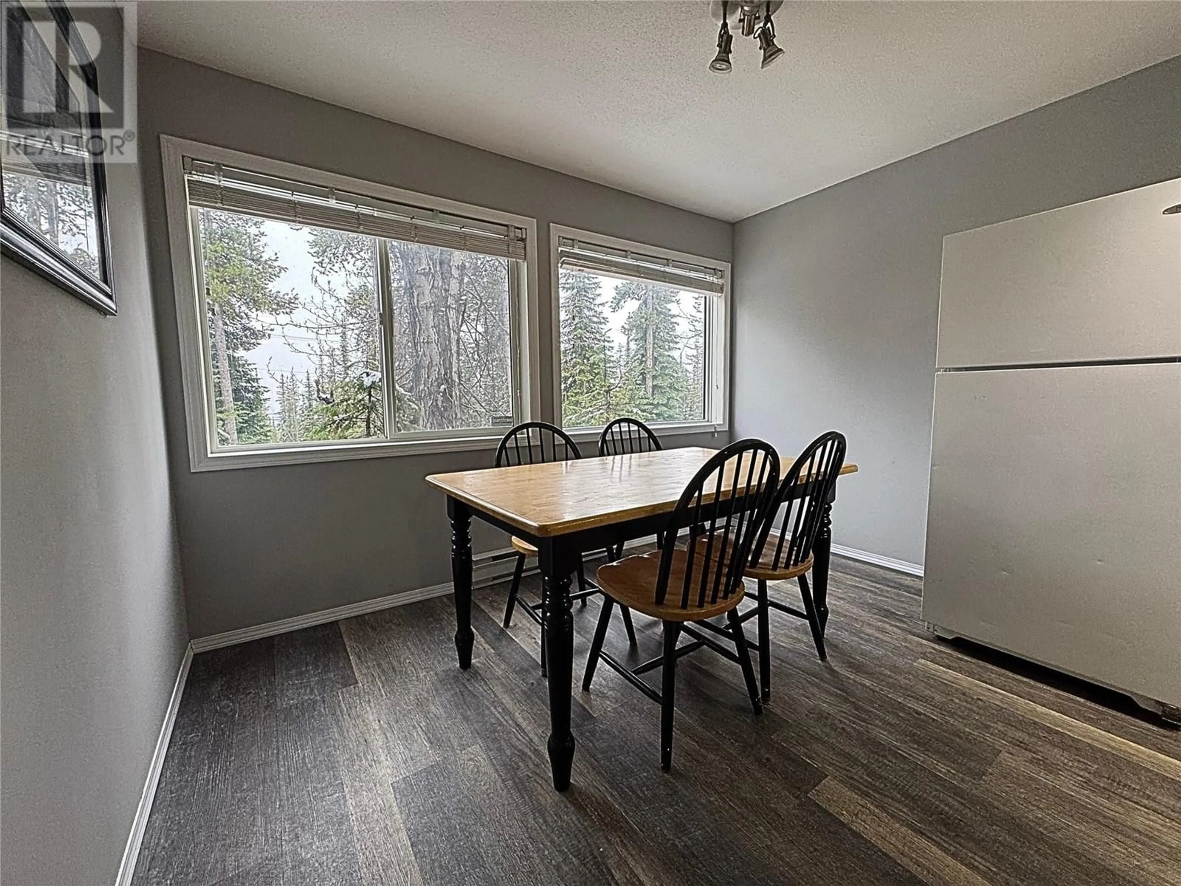 Dining room, wood/laminate floor for C - 4817 SNOWPINES ROAD, Big White British Columbia V1V1P3