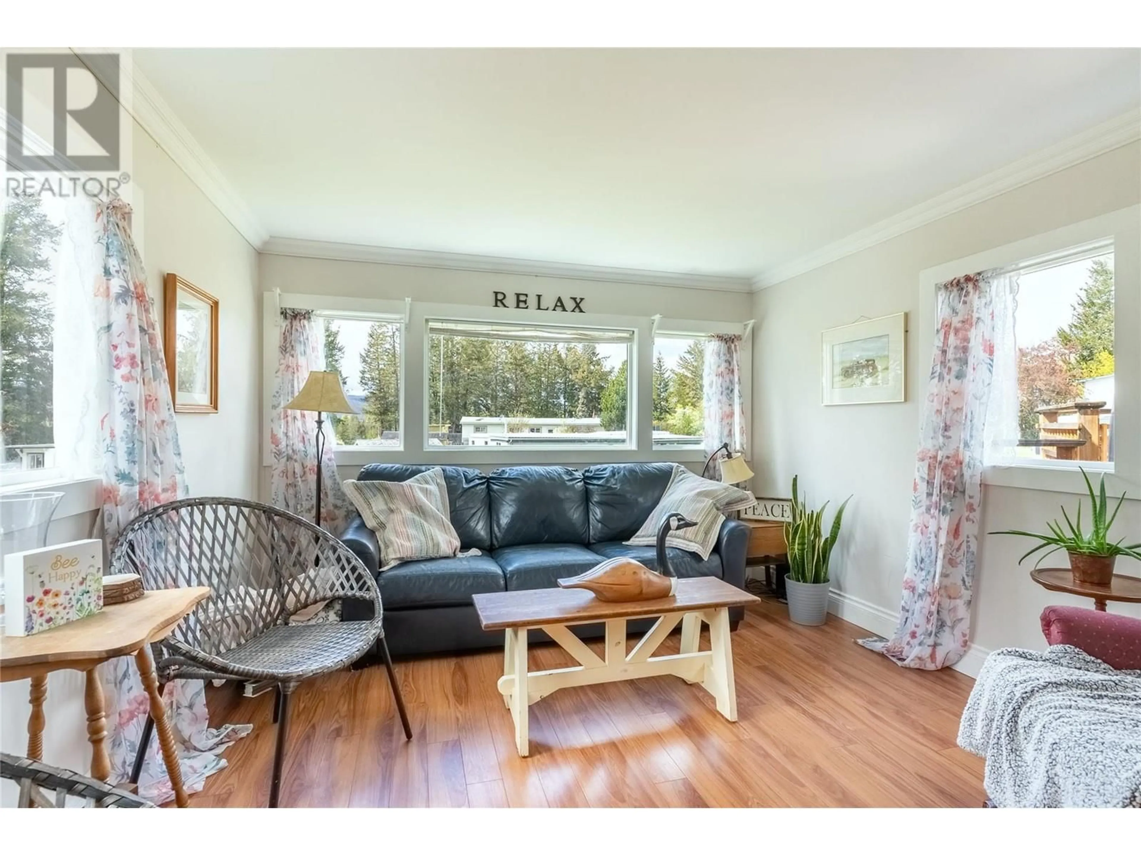 Living room with furniture, wood/laminate floor for 9 JADE COURT, Logan Lake British Columbia V0K1W0