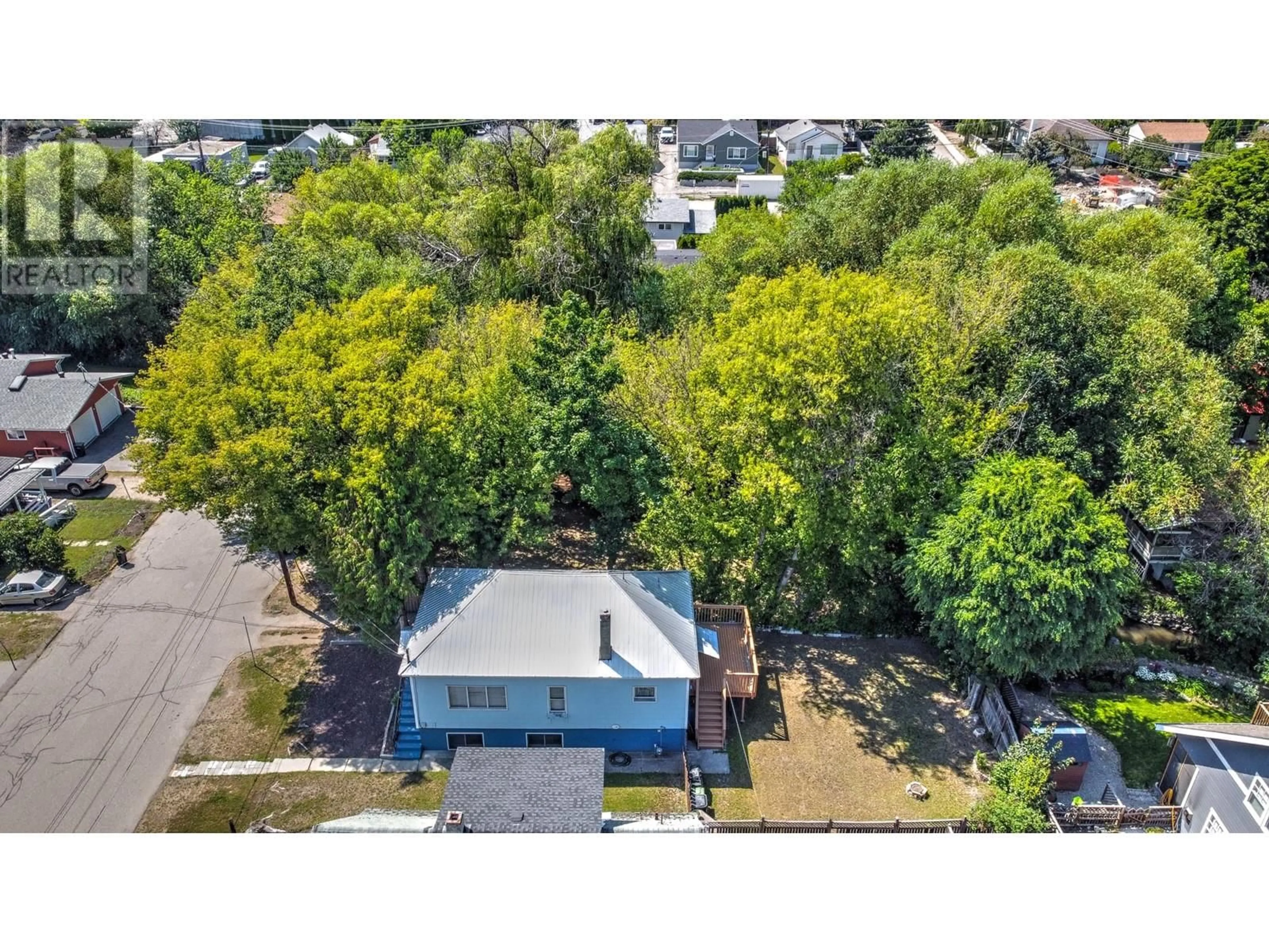 A pic from outside/outdoor area/front of a property/back of a property/a pic from drone, street for 3405 33 AVENUE, Vernon British Columbia V1T2P2