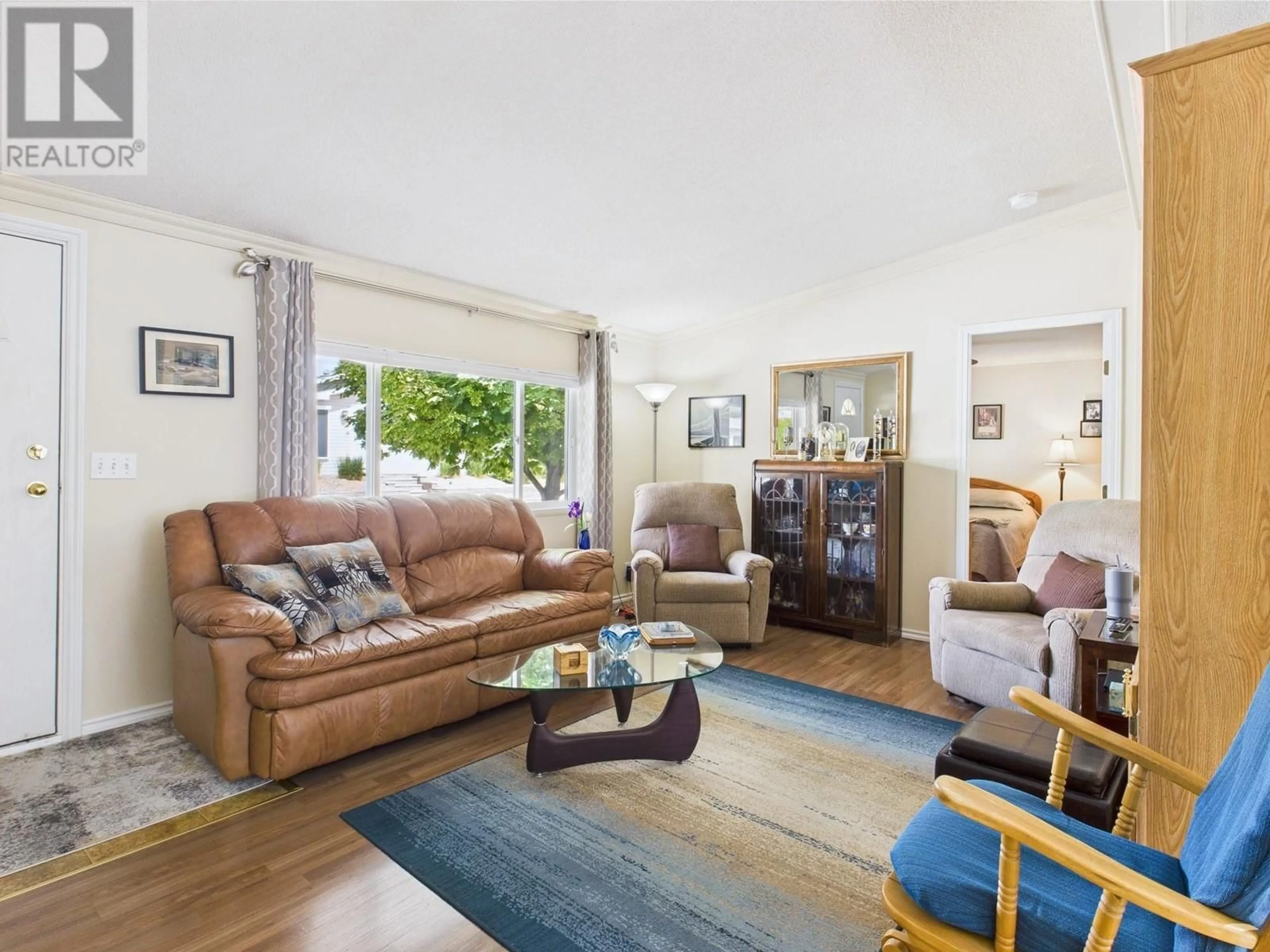 Living room with furniture, wood/laminate floor for 12 - 30 CACTUS CRESCENT, Osoyoos British Columbia V0H1V1