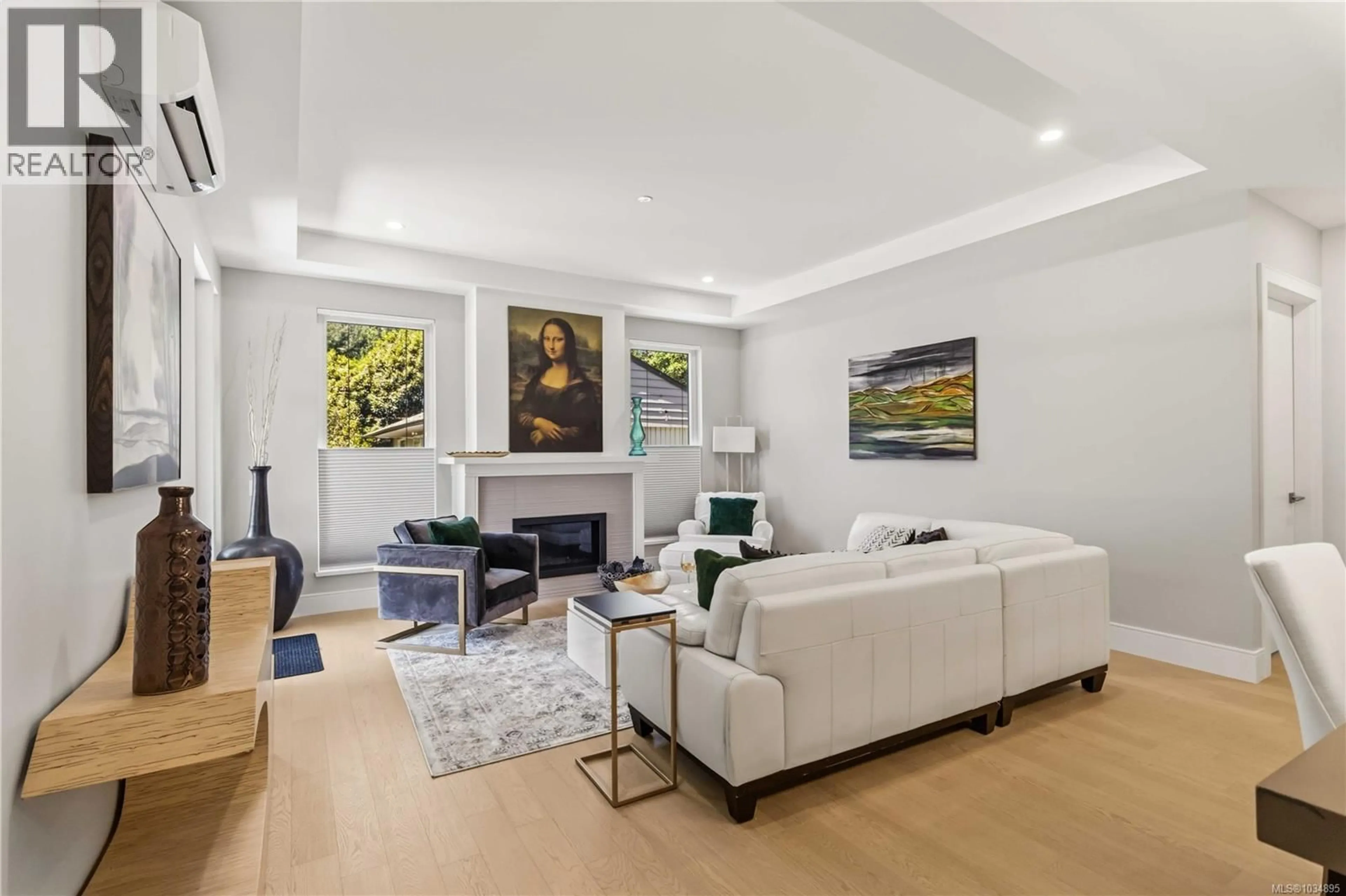 Living room with furniture, unknown for 201 - 990 DOUMAC AVENUE, Saanich British Columbia V8Y1M4