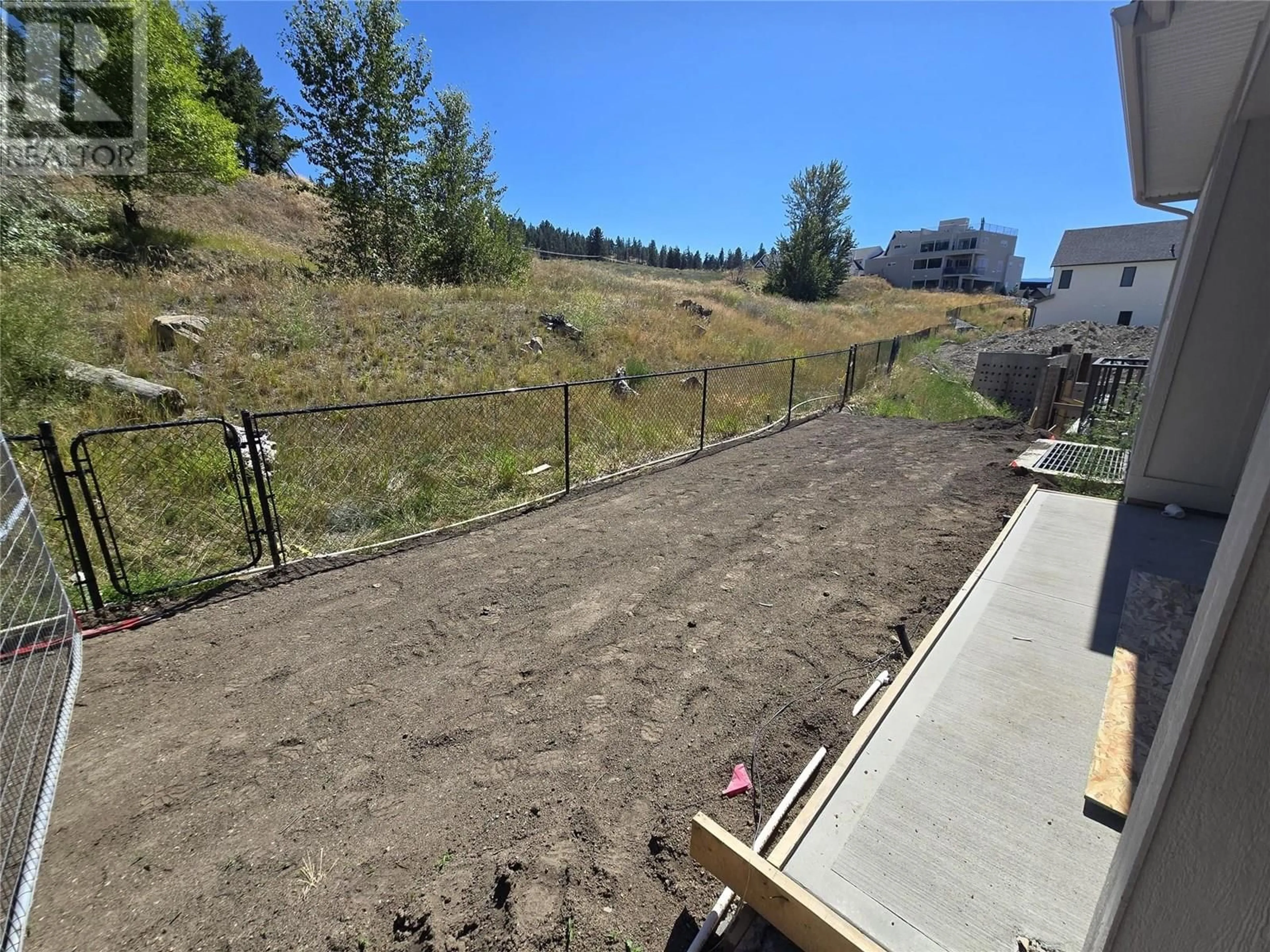 A pic from outside/outdoor area/front of a property/back of a property/a pic from drone, mountain view for 1012 BULL CRESCENT, Kelowna British Columbia V1W0E6