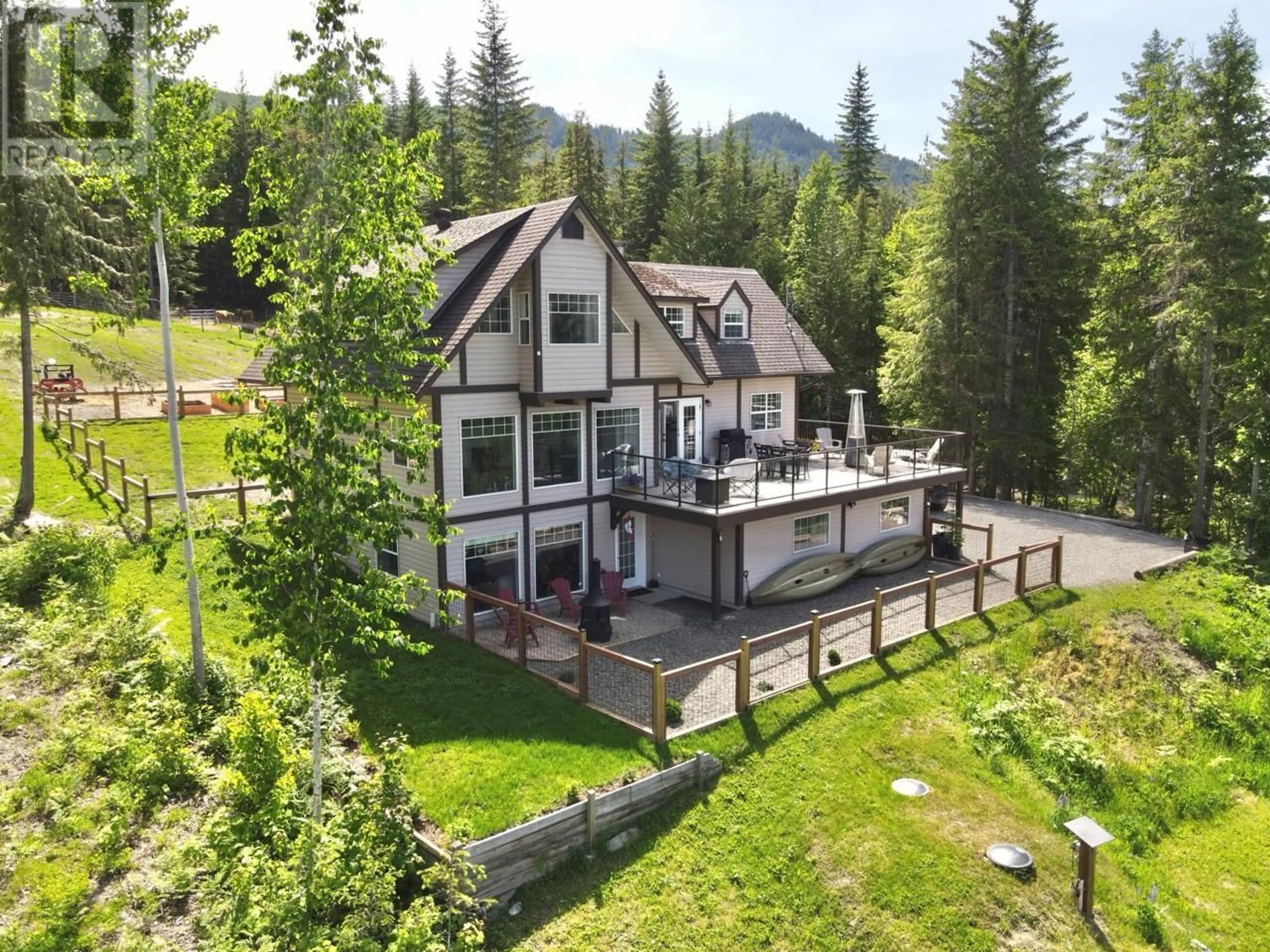 A pic from outside/outdoor area/front of a property/back of a property/a pic from drone, mountain view for 4784 IVY ROAD, Eagle Bay British Columbia V0E1T0
