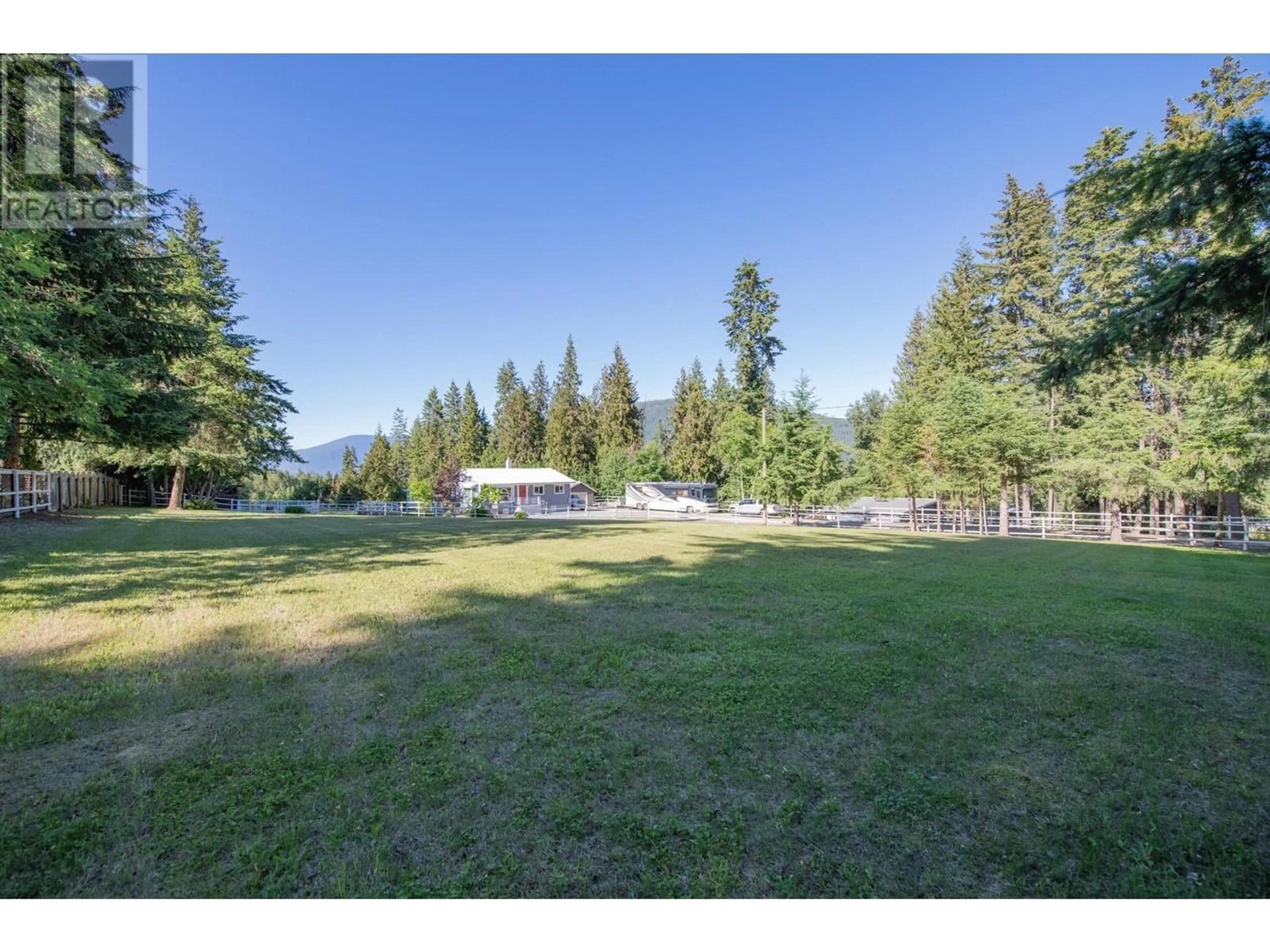 A pic from outside/outdoor area/front of a property/back of a property/a pic from drone, mountain view for 4091 10 AVENUE SOUTHEAST, Salmon Arm British Columbia V1E1W7