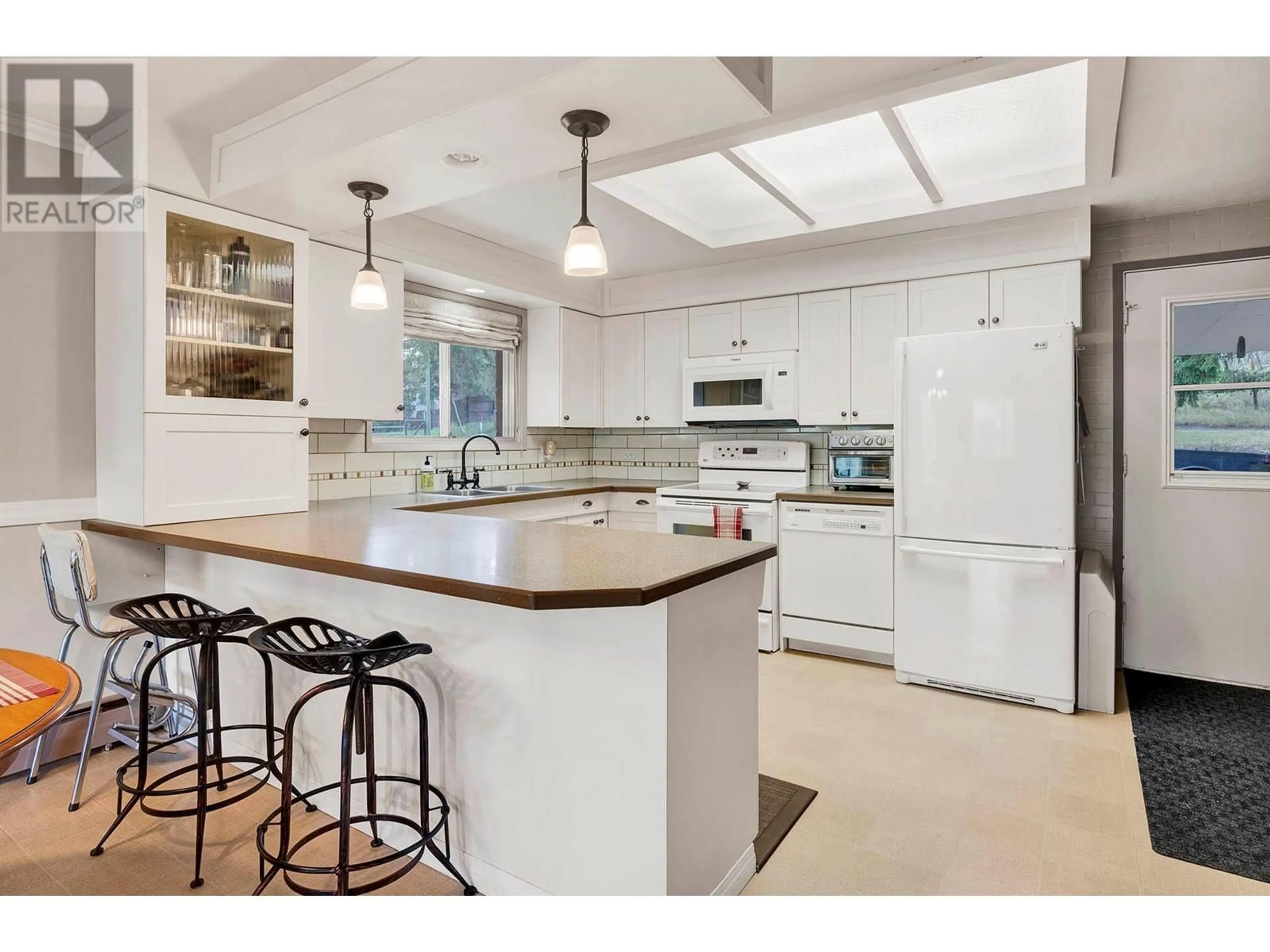 Open concept kitchen, ceramic/tile floor for 3120 DOHM ROAD, Kamloops British Columbia V2B7L8
