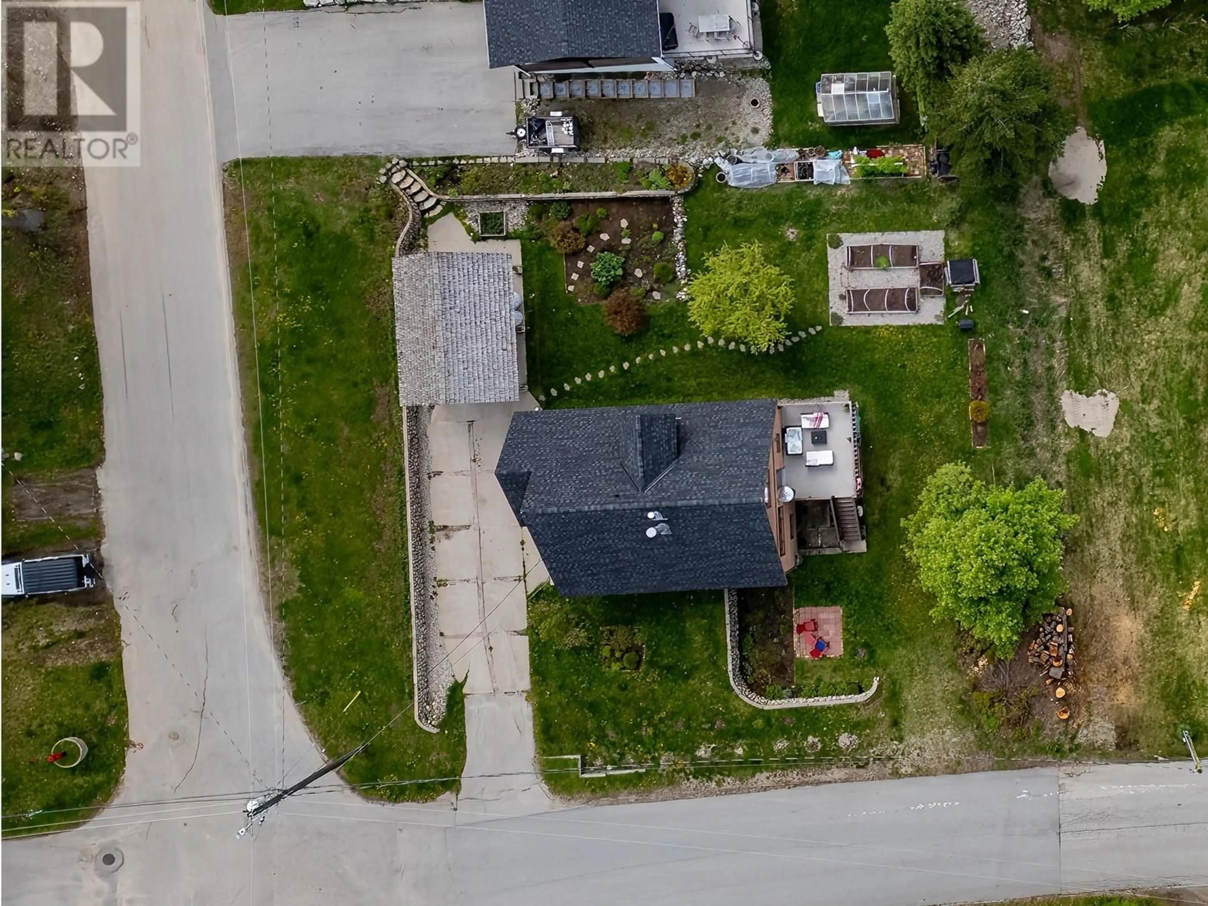 A pic from outside/outdoor area/front of a property/back of a property/a pic from drone, street for 1190 BLACK BEAR DRIVE, Rossland British Columbia V0G1Y0