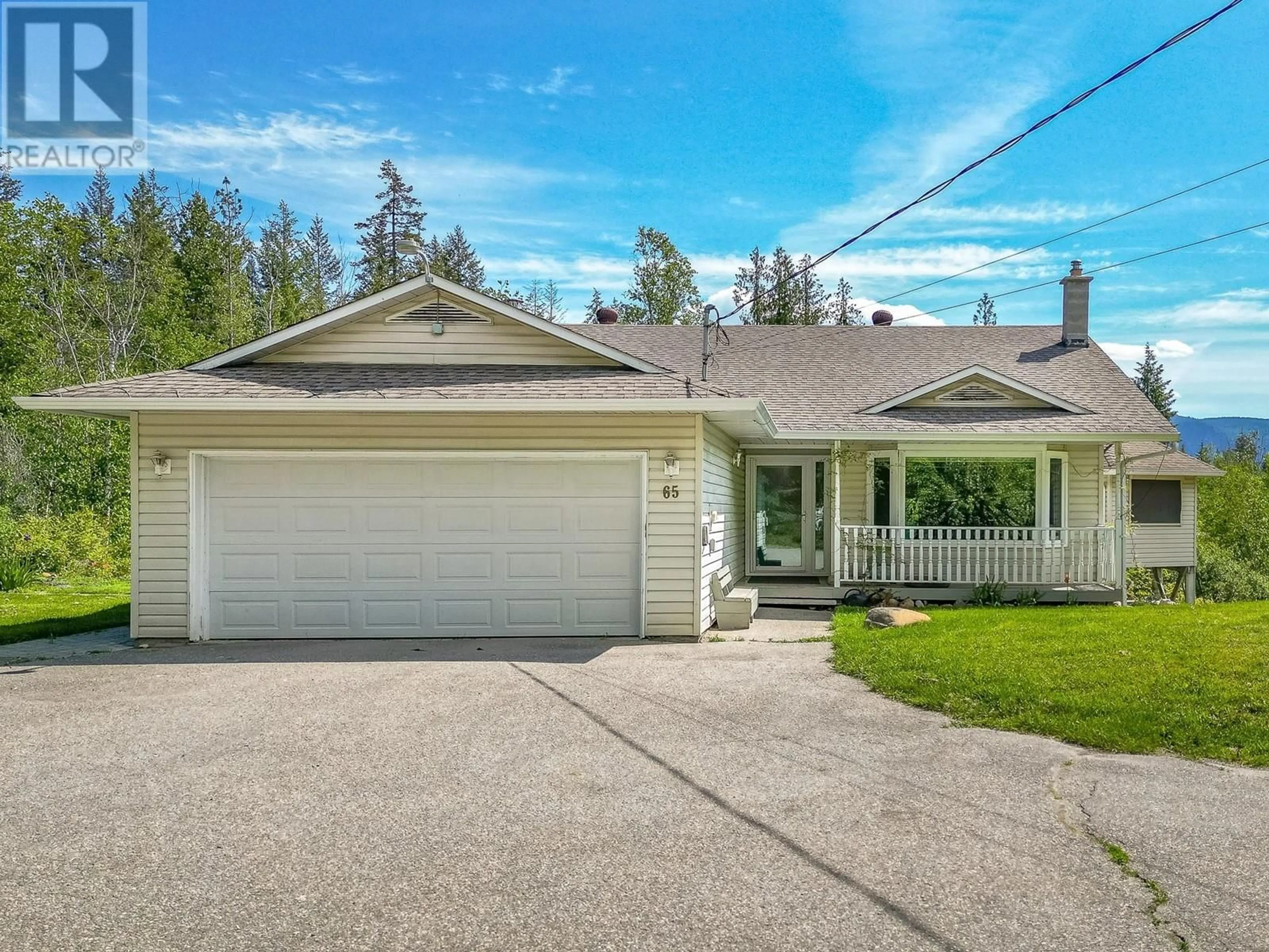 Home with vinyl exterior material, street for 65 GROVE ROAD, Enderby British Columbia V0E1V3