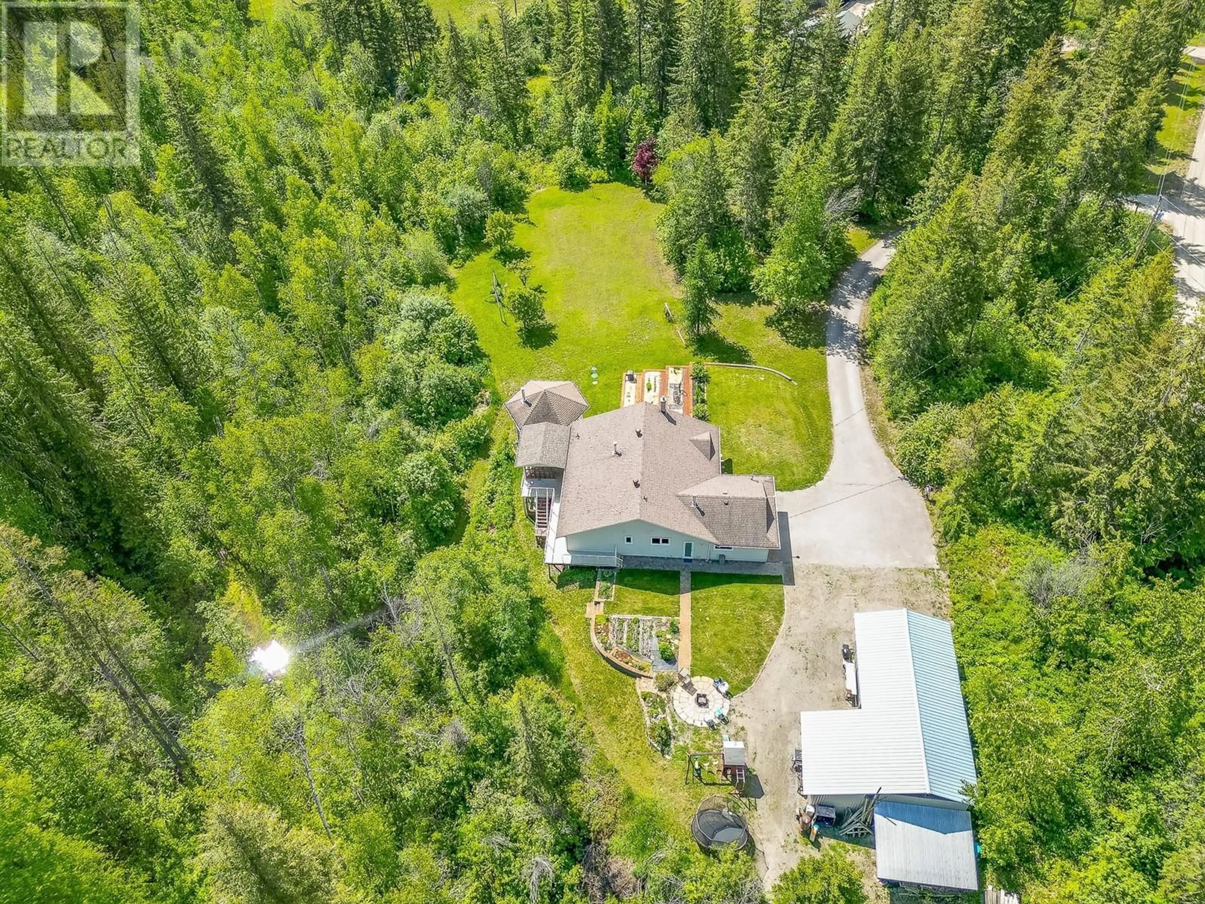 A pic from outside/outdoor area/front of a property/back of a property/a pic from drone, forest/trees view for 65 GROVE ROAD, Enderby British Columbia V0E1V3