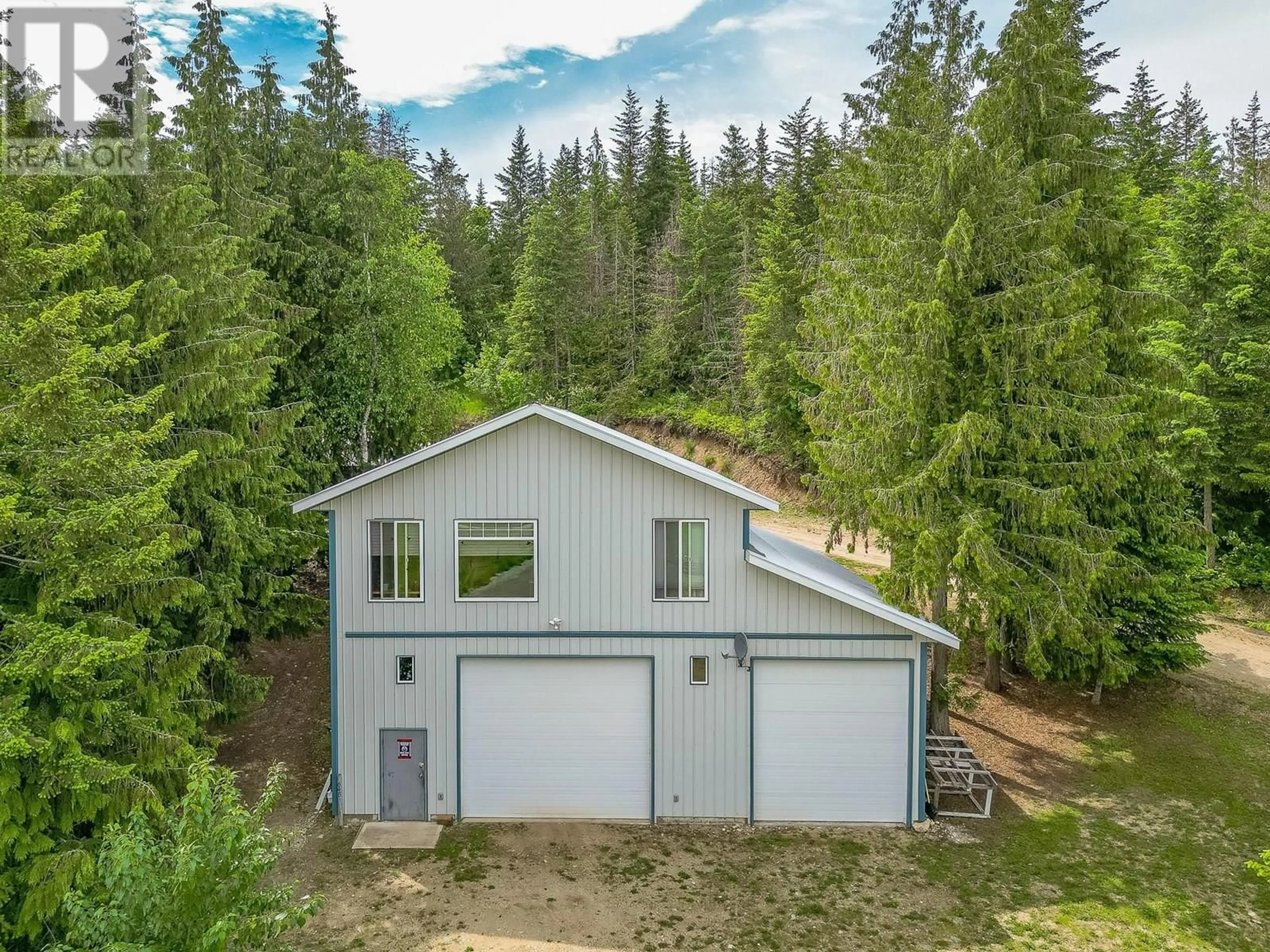 A pic from outside/outdoor area/front of a property/back of a property/a pic from drone, forest/trees view for 645 CAPRI ROAD, Enderby British Columbia V0E1V3