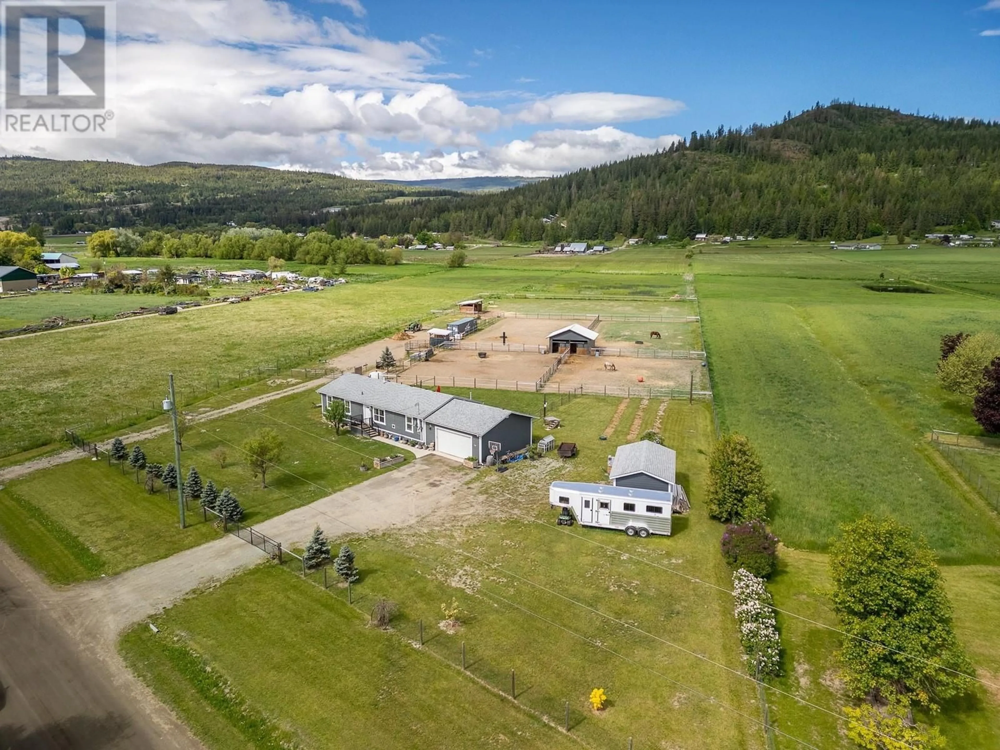 A pic from outside/outdoor area/front of a property/back of a property/a pic from drone, mountain view for 94 TOMKINSON ROAD, Grindrod British Columbia V0E1Y0