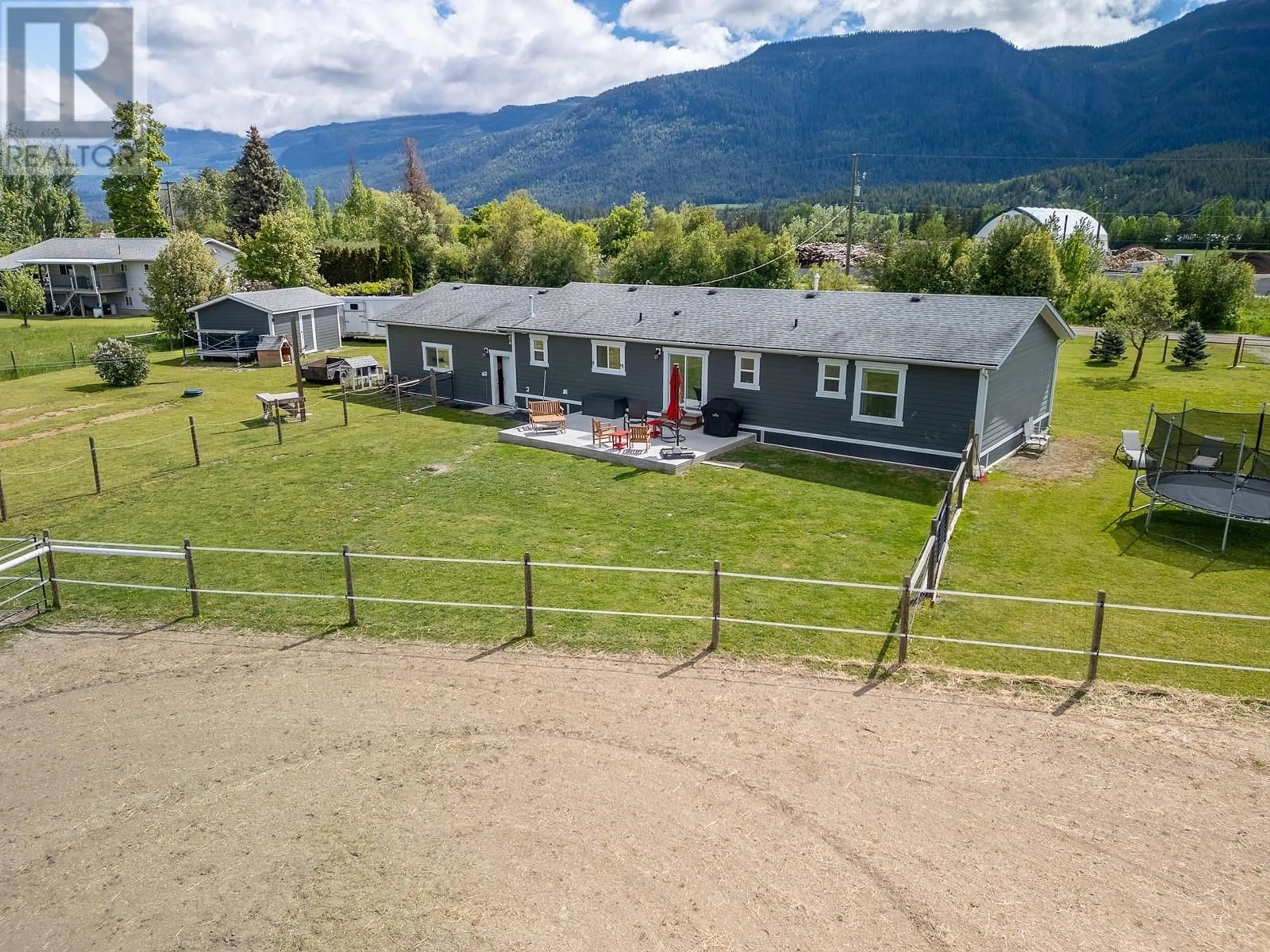 A pic from outside/outdoor area/front of a property/back of a property/a pic from drone, mountain view for 94 TOMKINSON ROAD, Grindrod British Columbia V0E1Y0