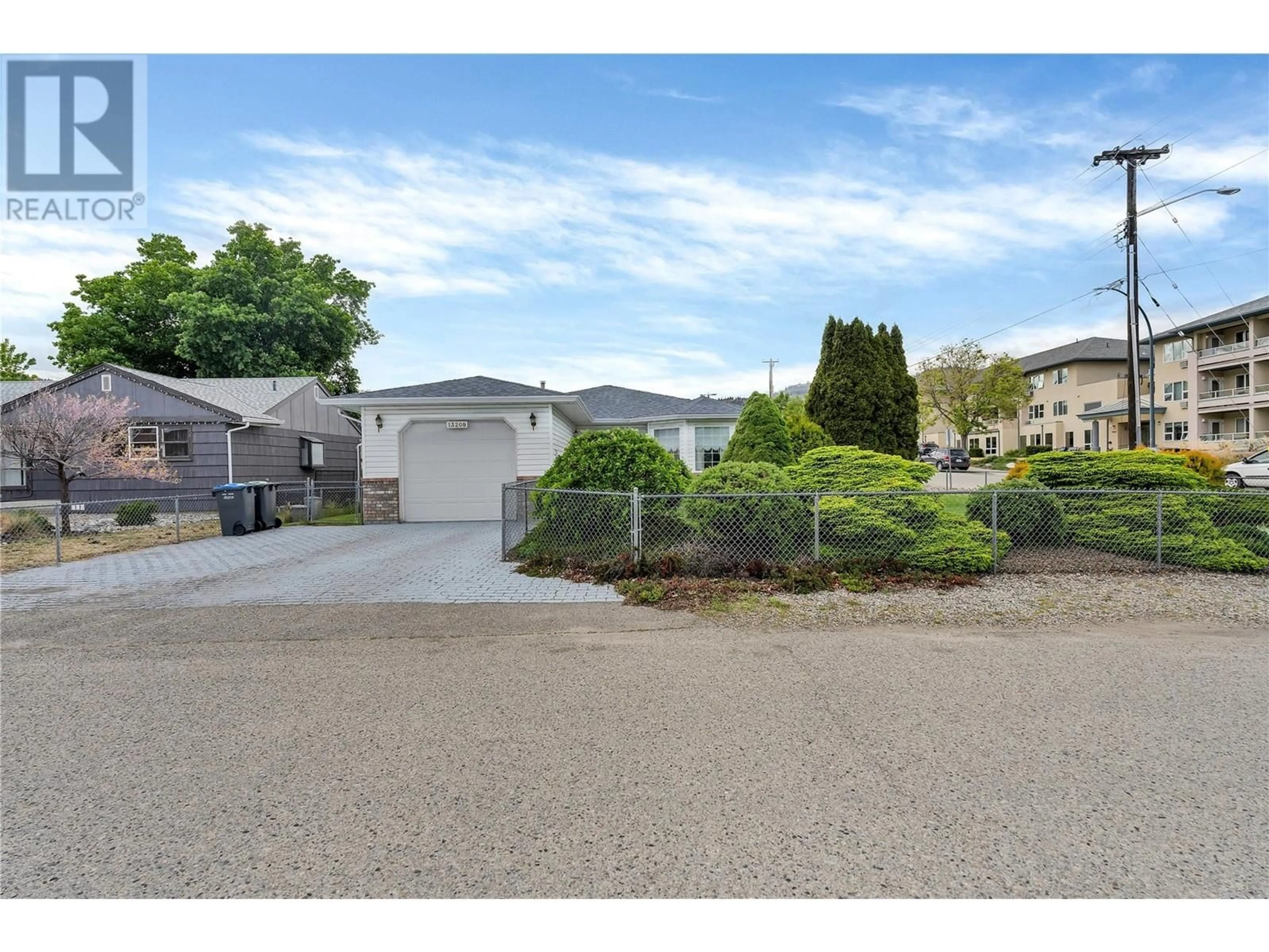 A pic from outside/outdoor area/front of a property/back of a property/a pic from drone, street for 13208 ARMSTRONG AVENUE, Summerland British Columbia V0H1Z0