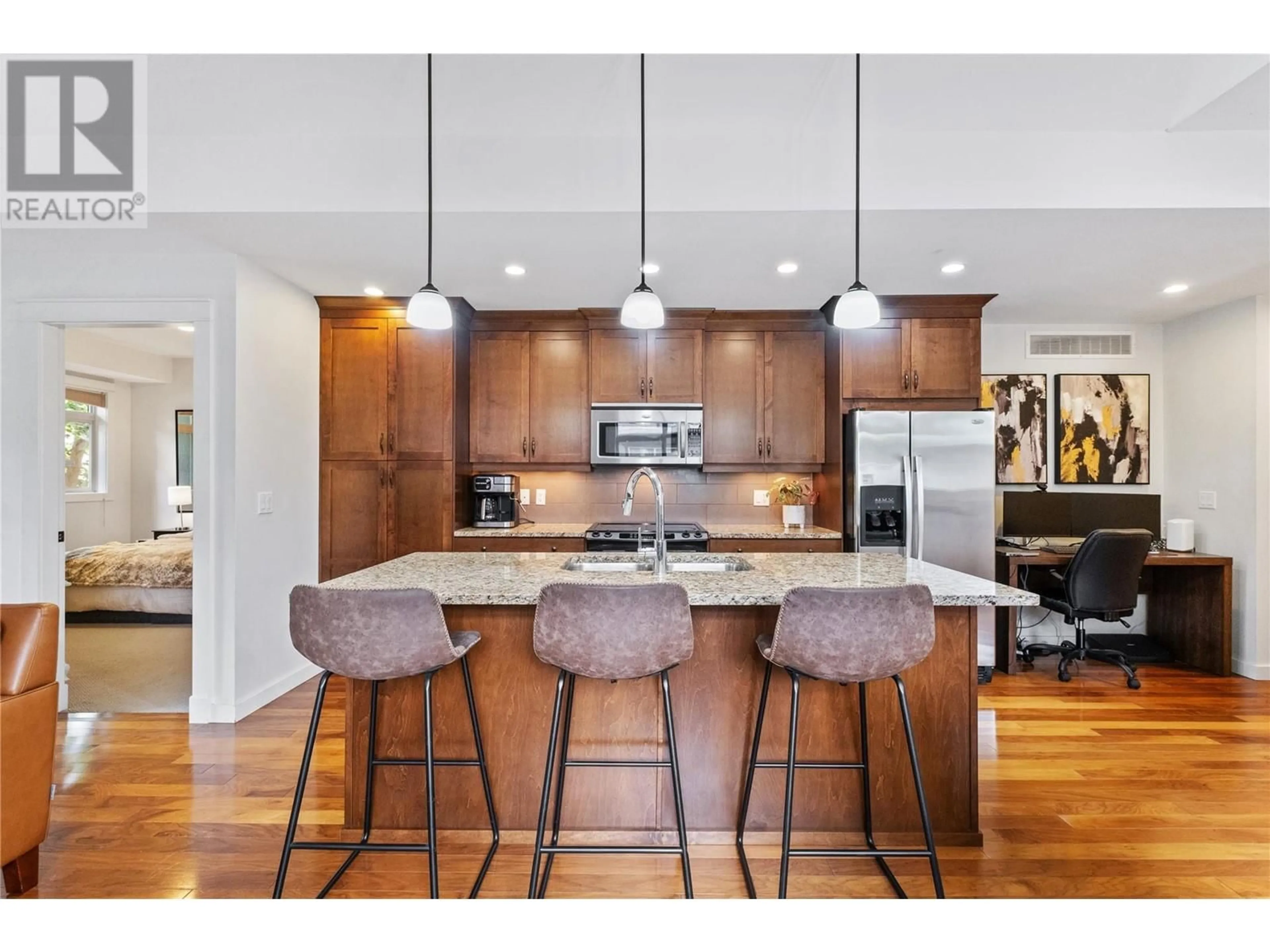 Open concept kitchen, wood/laminate floor for 219 - 511 YATES ROAD, Kelowna British Columbia V1V2X2