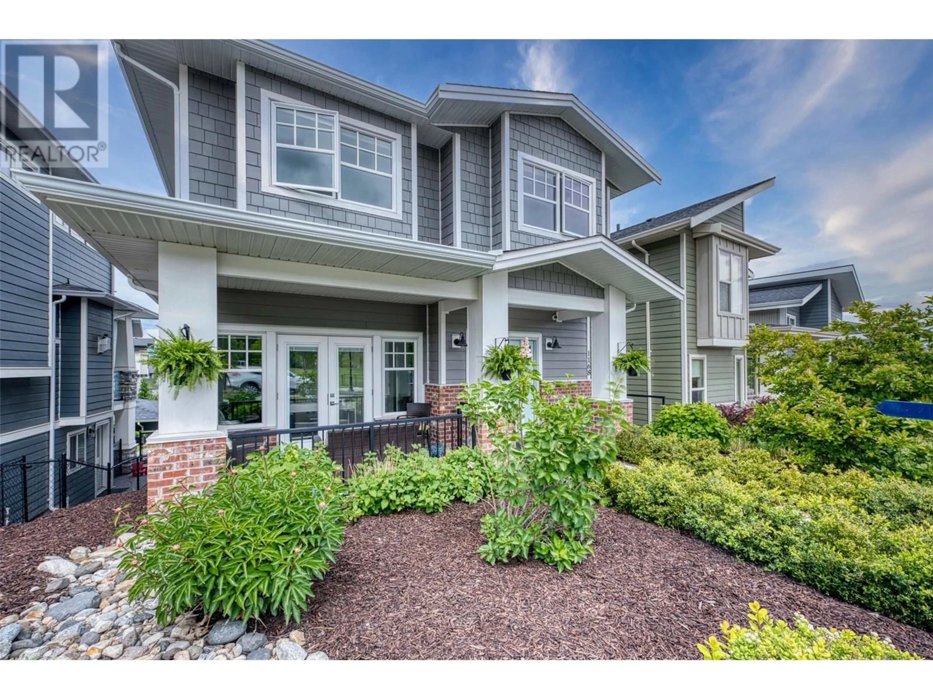 Home with vinyl exterior material, street for 1168 FROST ROAD, Kelowna British Columbia V1W5M1