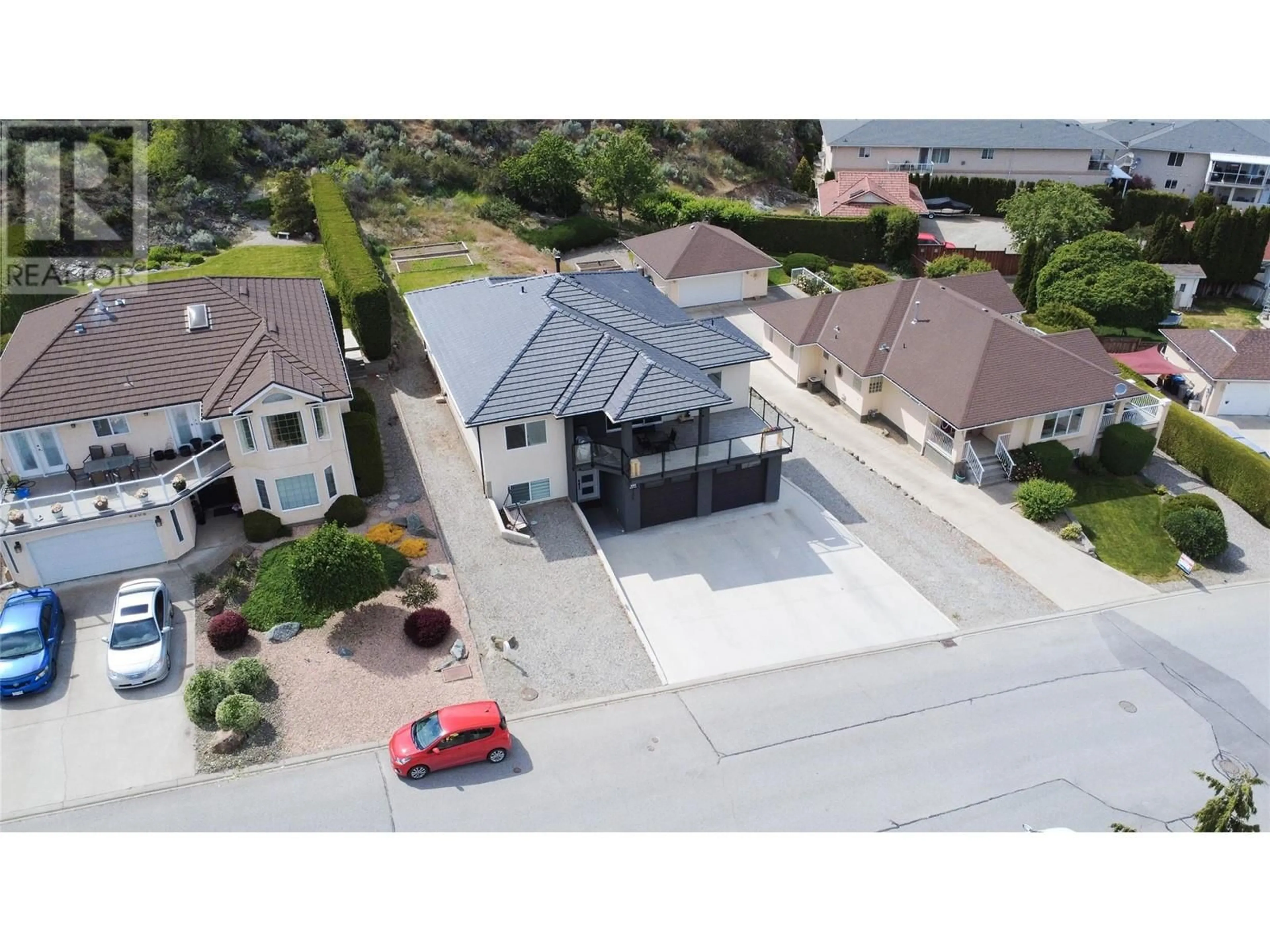 A pic from outside/outdoor area/front of a property/back of a property/a pic from drone, street for 4208 FAIRWINDS DRIVE, Osoyoos British Columbia V0H1V4