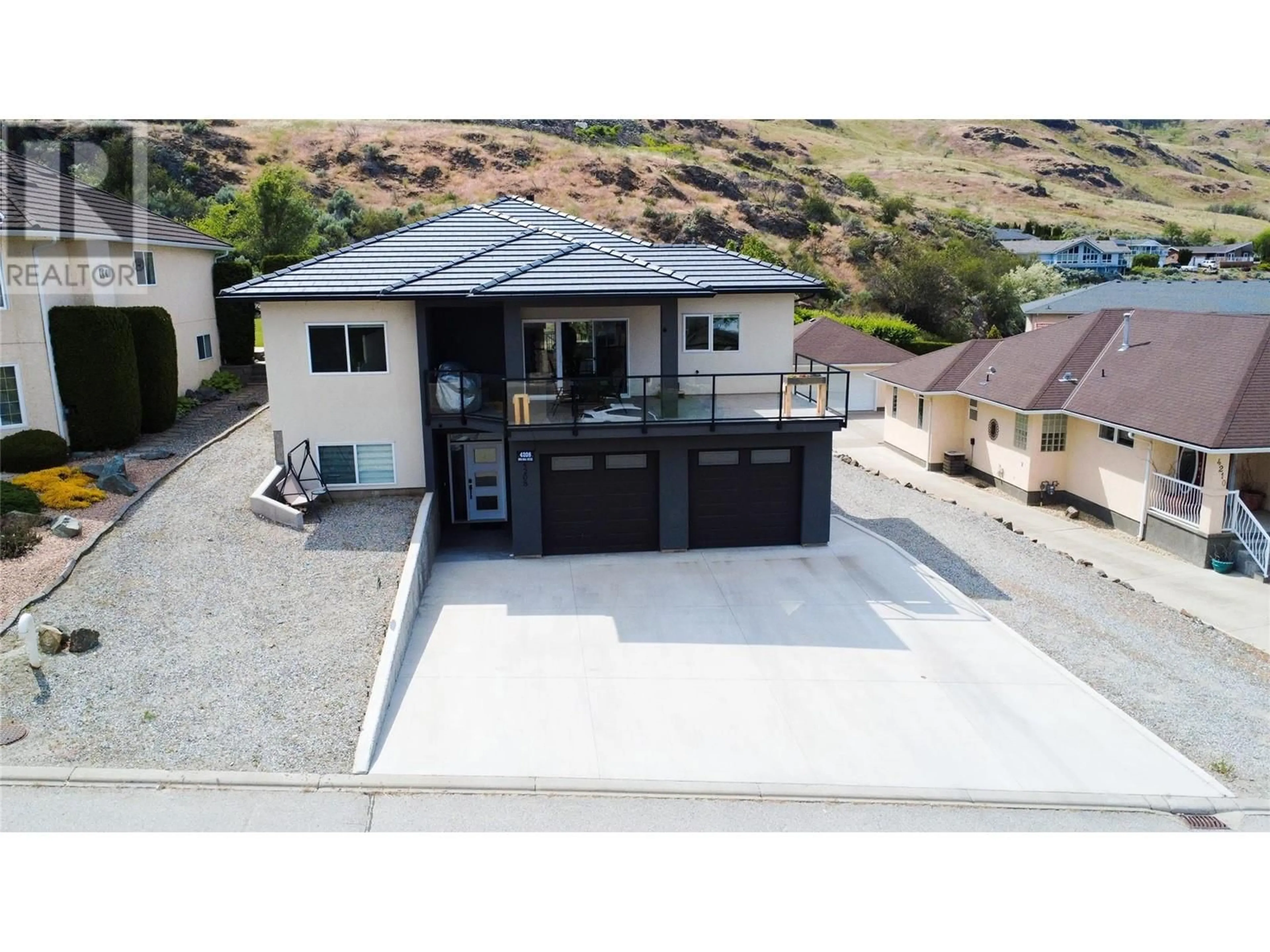 A pic from outside/outdoor area/front of a property/back of a property/a pic from drone, street for 4208 FAIRWINDS DRIVE, Osoyoos British Columbia V0H1V4