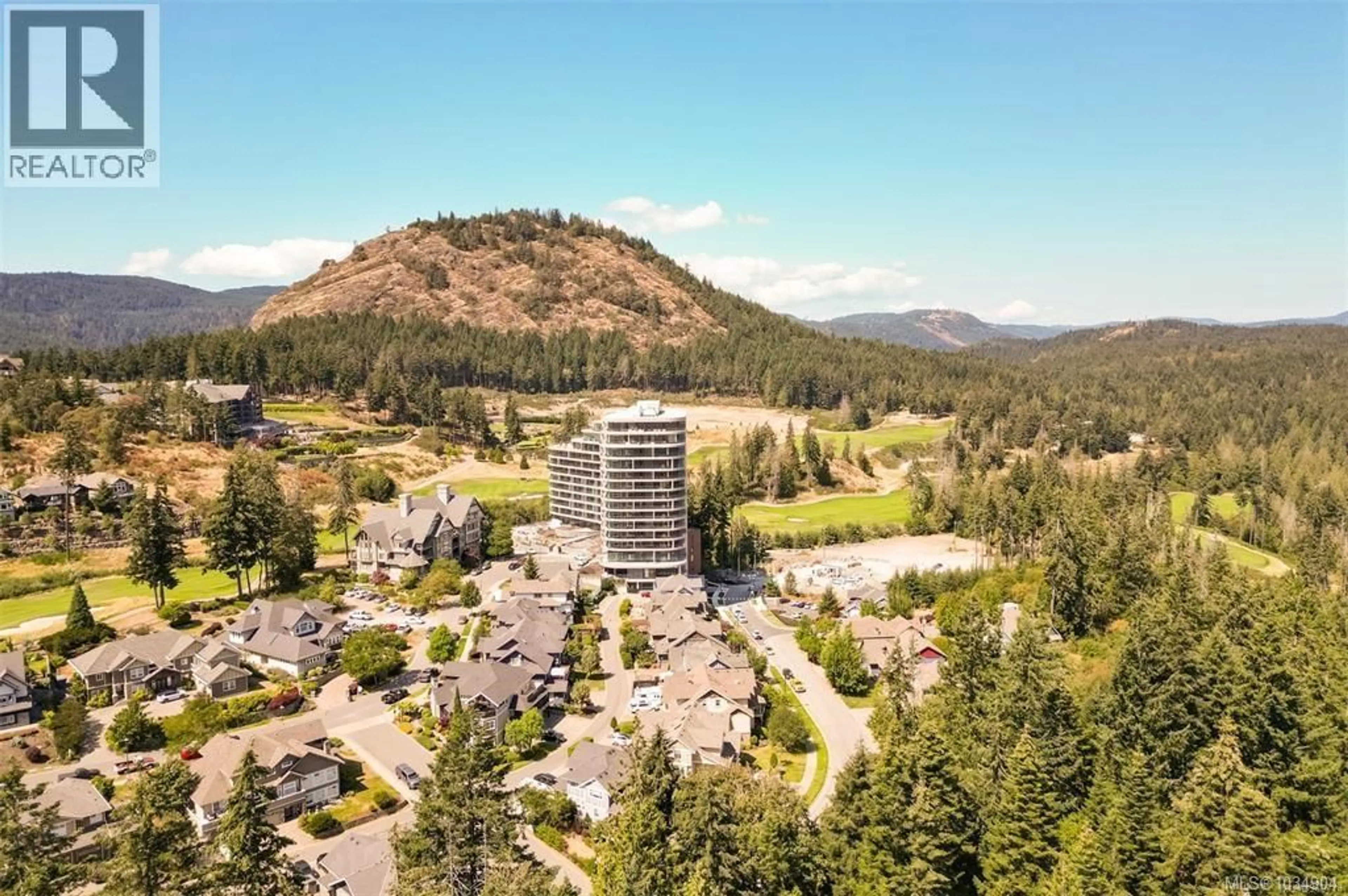 A pic from outside/outdoor area/front of a property/back of a property/a pic from drone, mountain view for 711 - 2000 HANNINGTON ROAD, Langford British Columbia V9B6R6