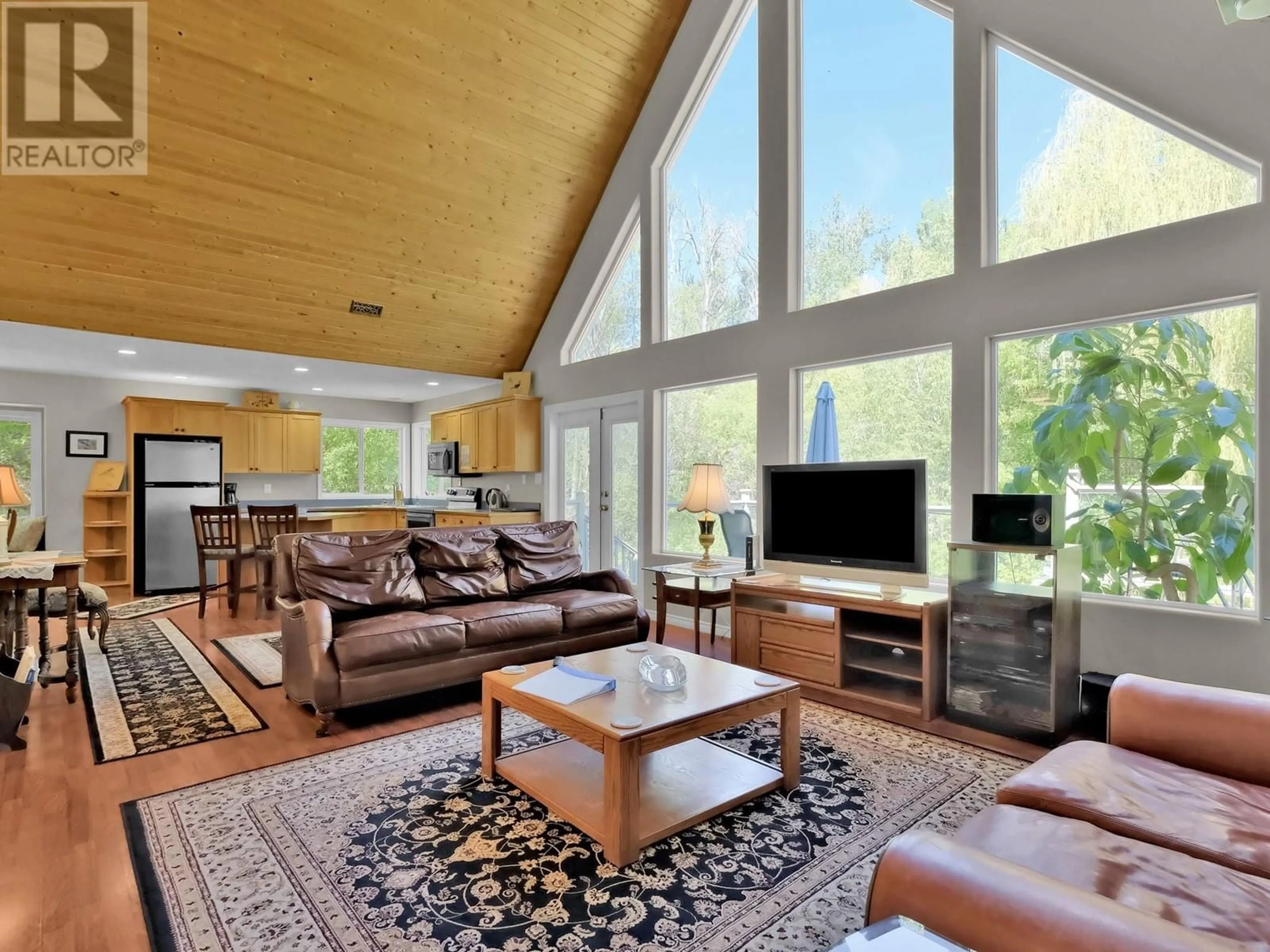 Living room with furniture, wood/laminate floor for 15014 KATO STREET, Summerland British Columbia V0H1Z0
