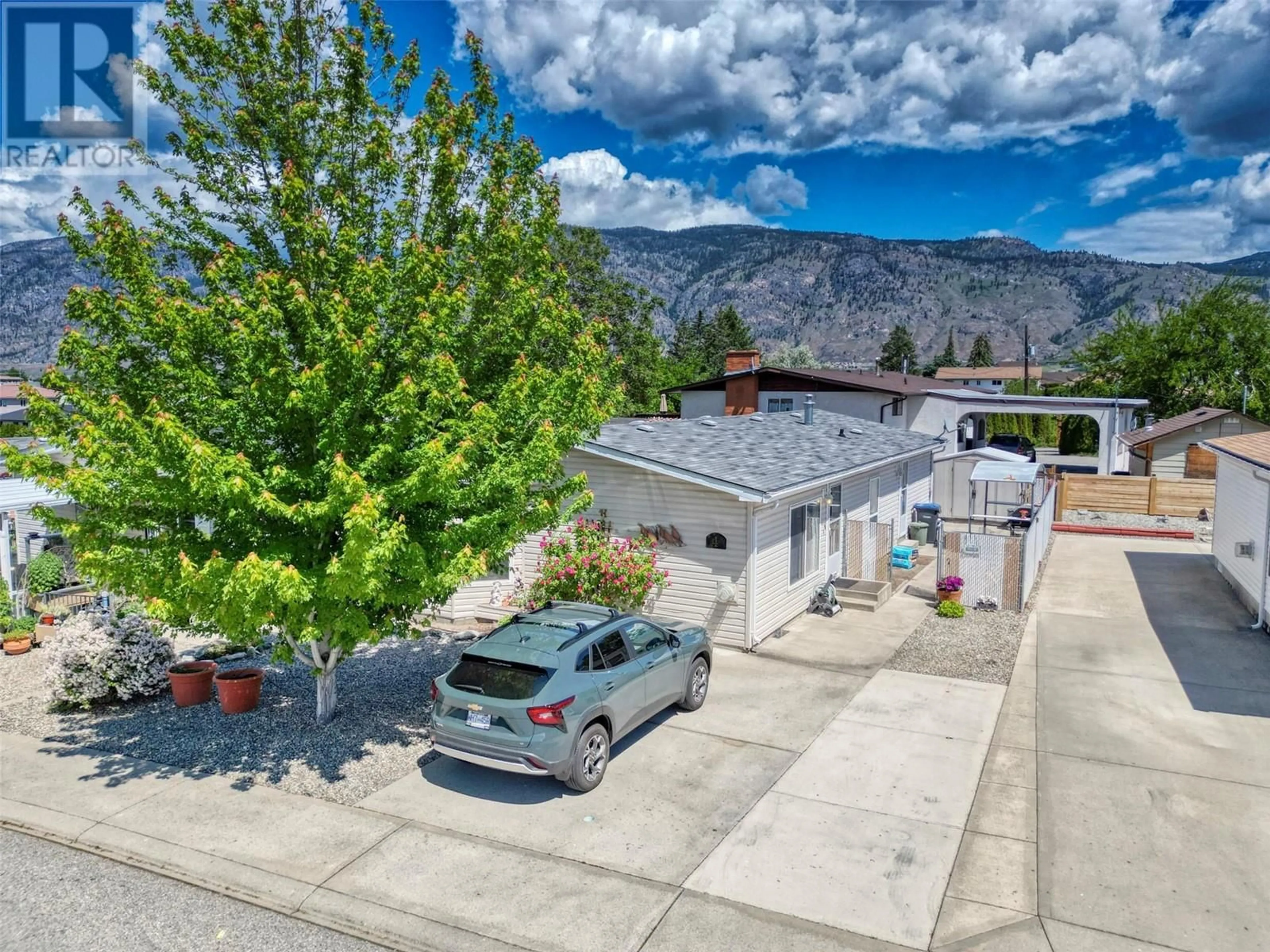 A pic from outside/outdoor area/front of a property/back of a property/a pic from drone, mountain view for 4 - 30 CACTUS CRESCENT, Osoyoos British Columbia V0H1V1