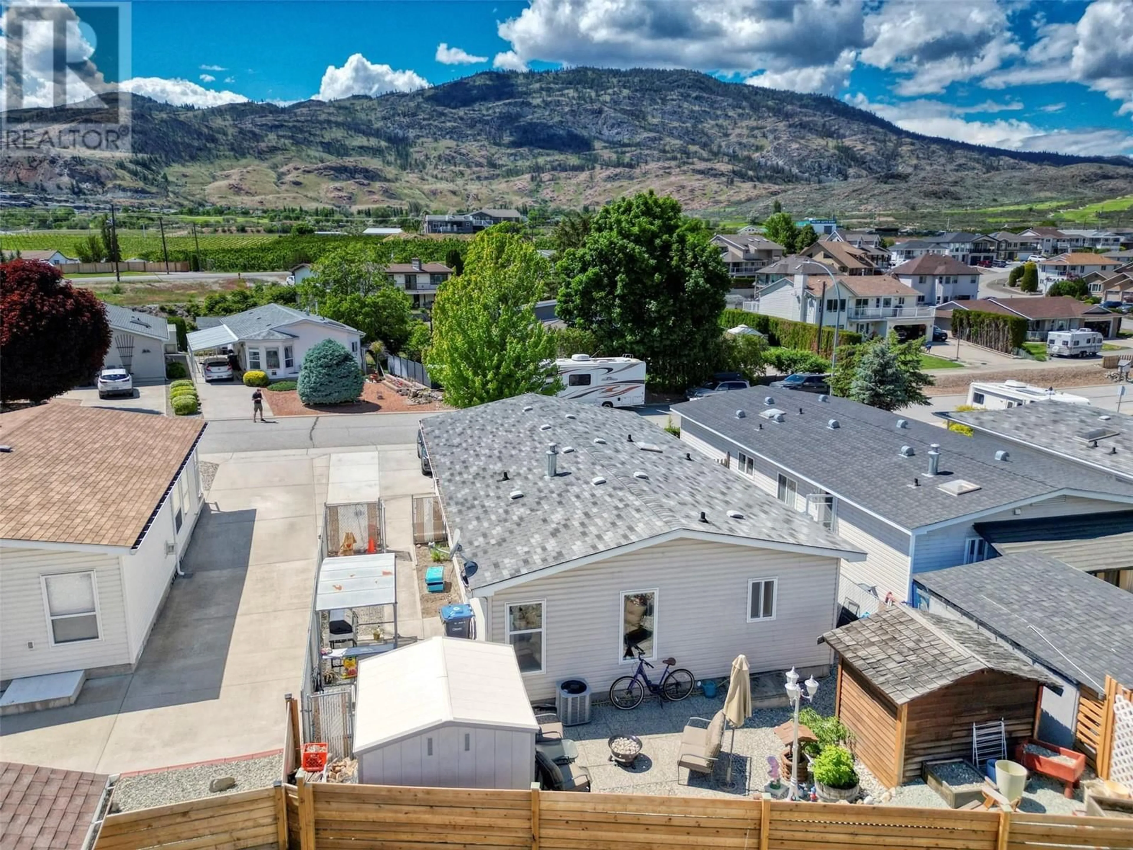 A pic from outside/outdoor area/front of a property/back of a property/a pic from drone, mountain view for 4 - 30 CACTUS CRESCENT, Osoyoos British Columbia V0H1V1