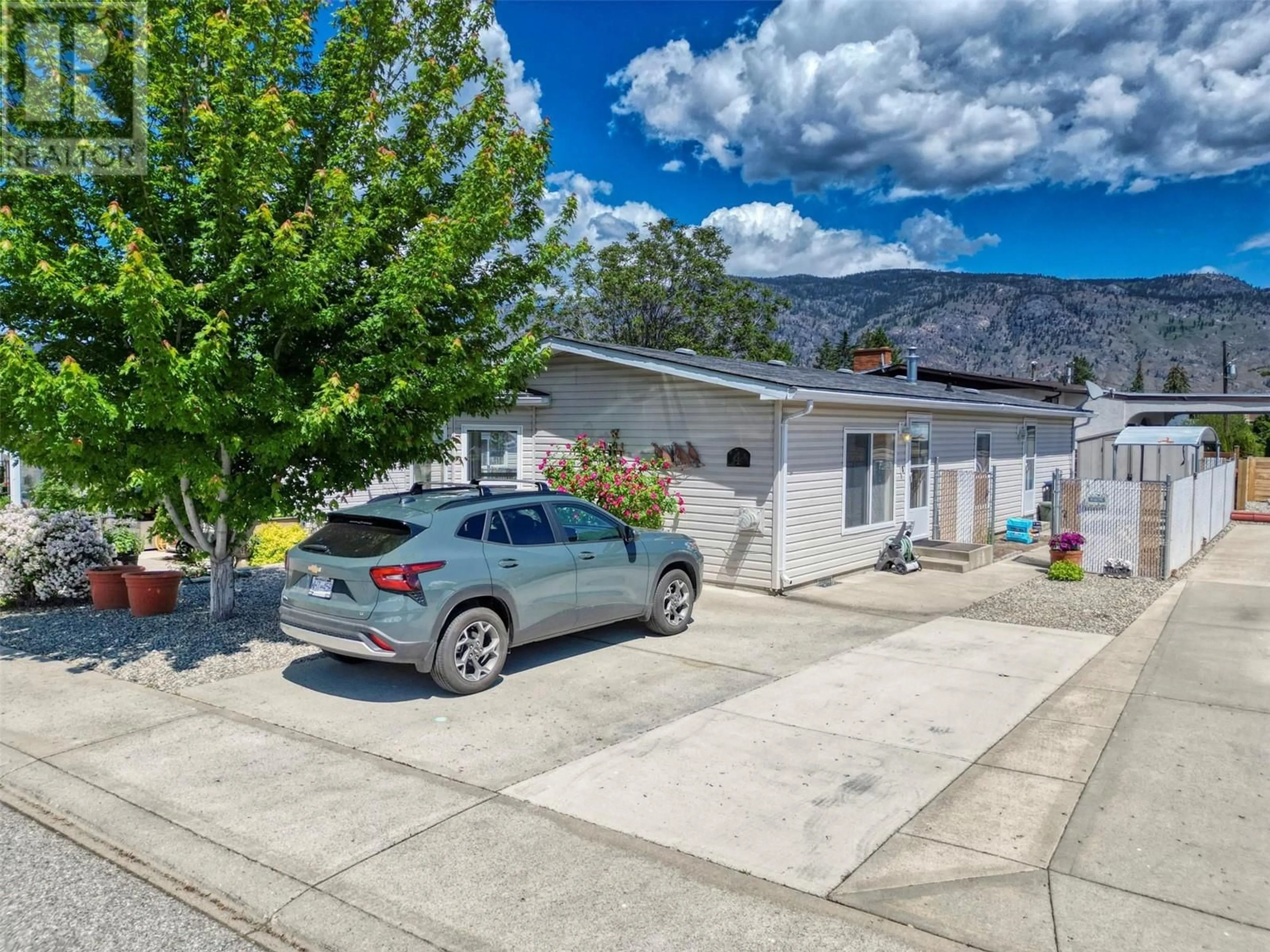 A pic from outside/outdoor area/front of a property/back of a property/a pic from drone, mountain view for 4 - 30 CACTUS CRESCENT, Osoyoos British Columbia V0H1V1