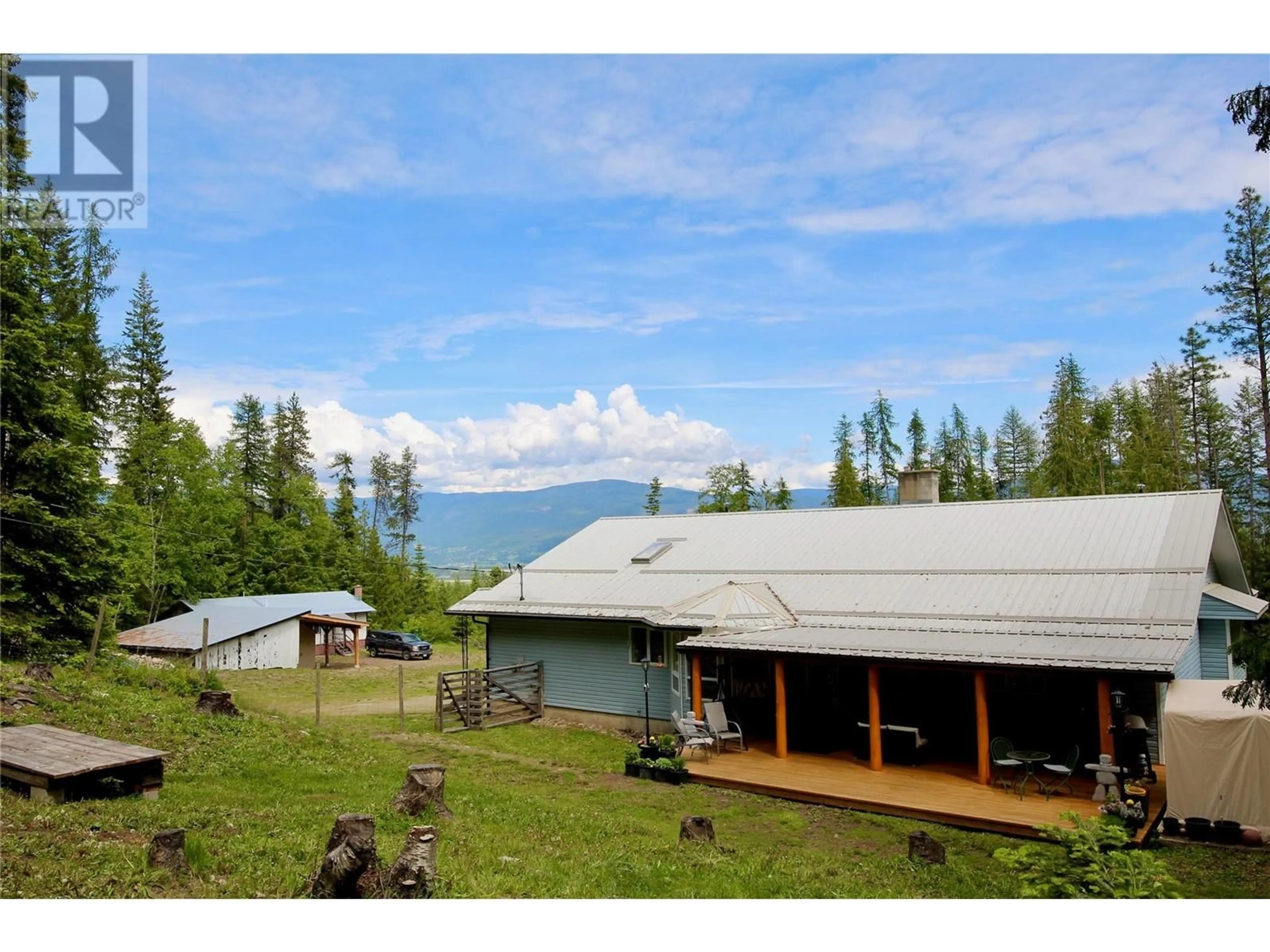 A pic from outside/outdoor area/front of a property/back of a property/a pic from drone, mountain view for 1 - 1449 EVANS ROAD, Creston British Columbia V0B1G7