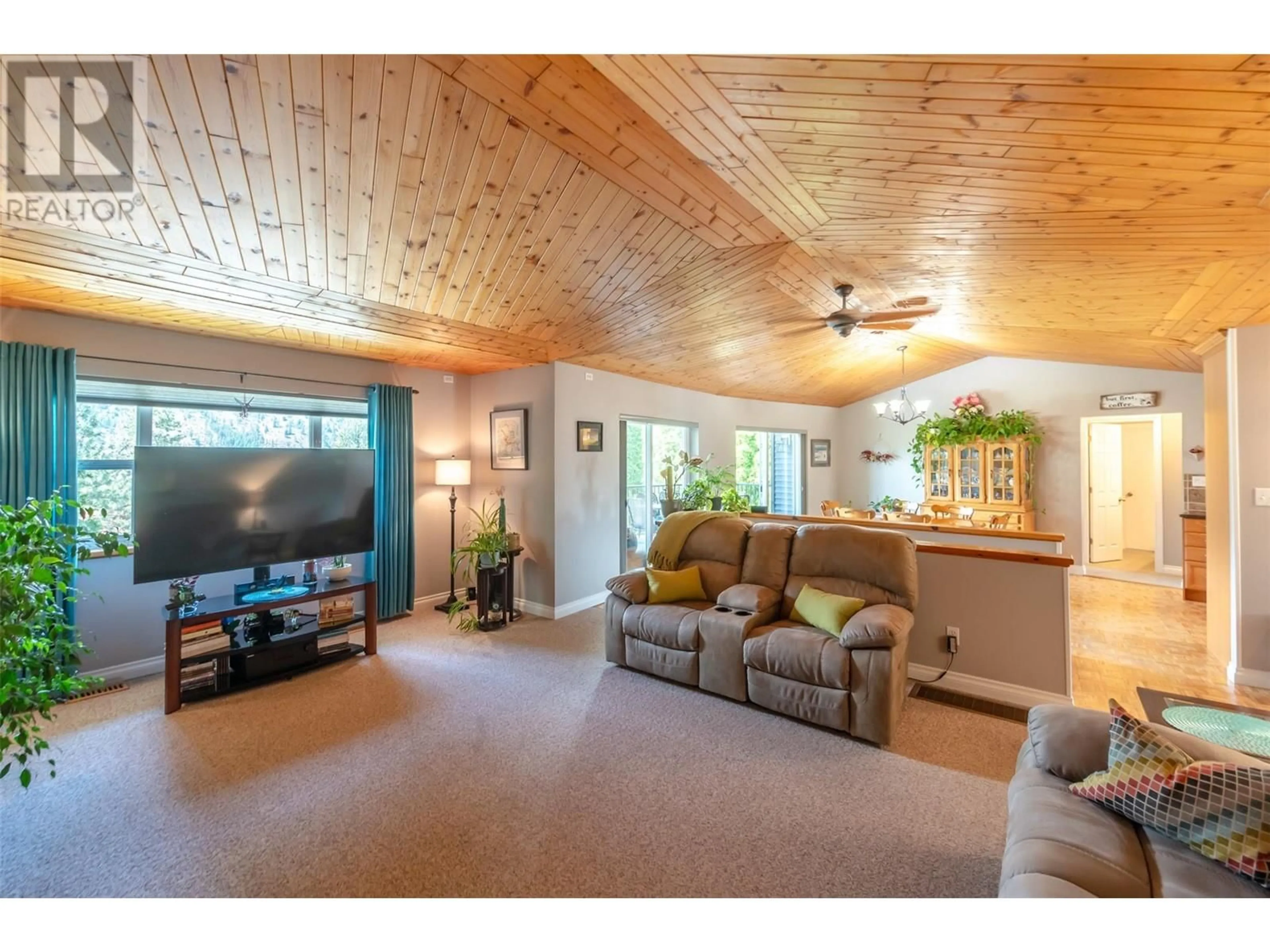 Living room with furniture, wood/laminate floor for 1332 PEACHCLIFF DRIVE, Okanagan Falls British Columbia V0H1R1