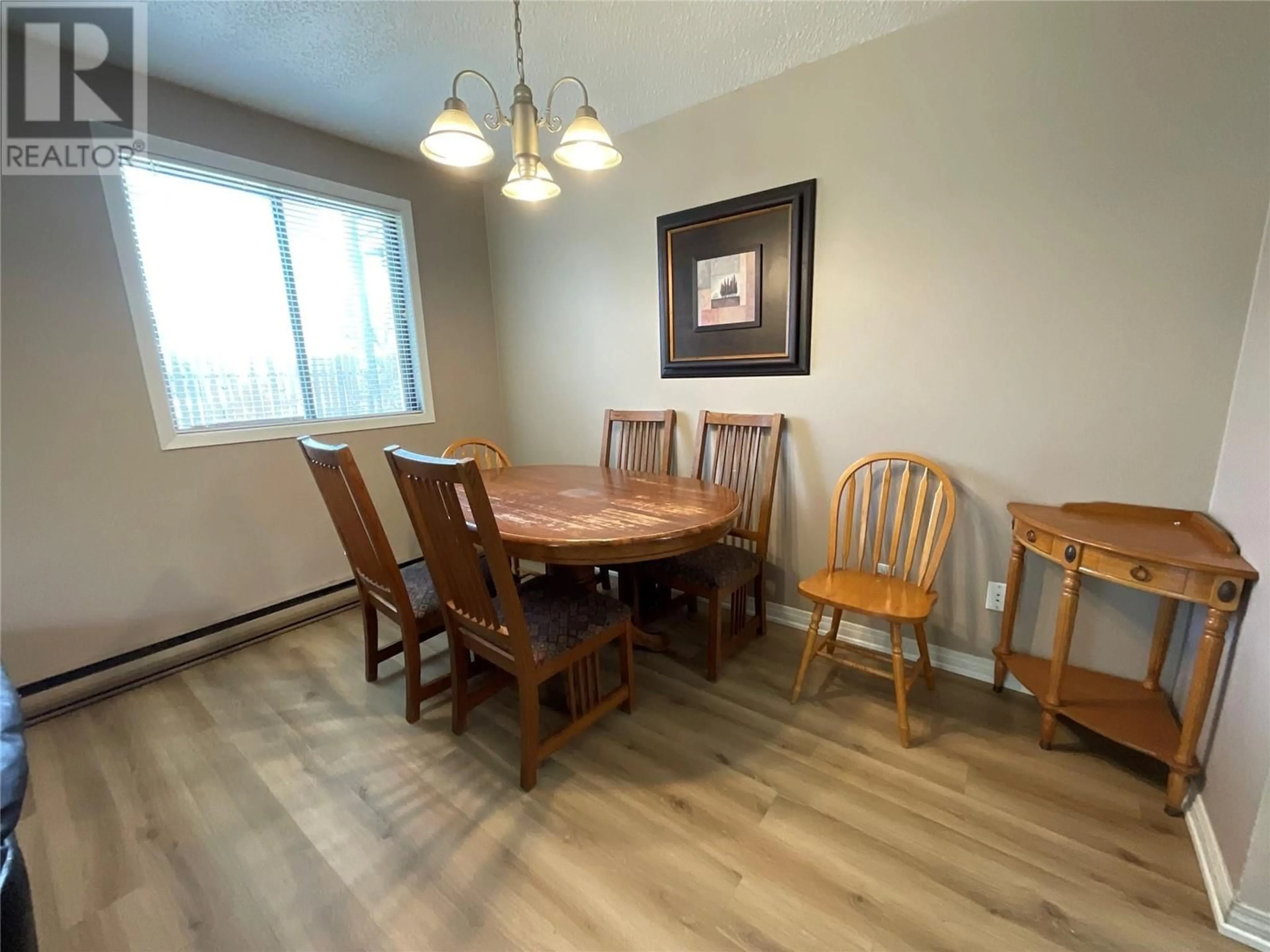 Dining room, wood/laminate floor for 105 - 212 SPIEKER AVENUE, Tumbler Ridge British Columbia V0C2W0