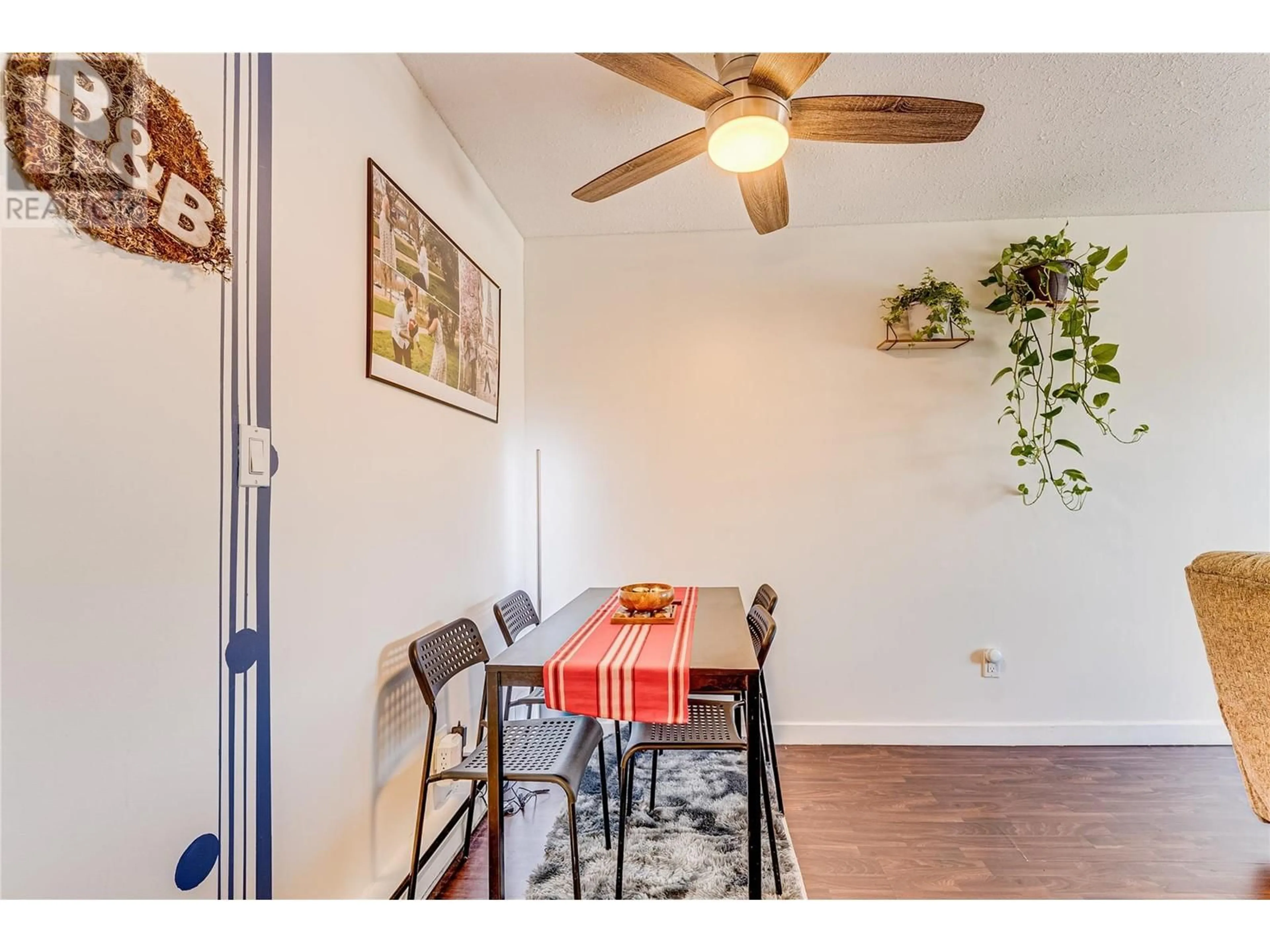 Dining room, wood/laminate floor for 208 - 3304 35TH AVENUE, Vernon British Columbia V1T8M6