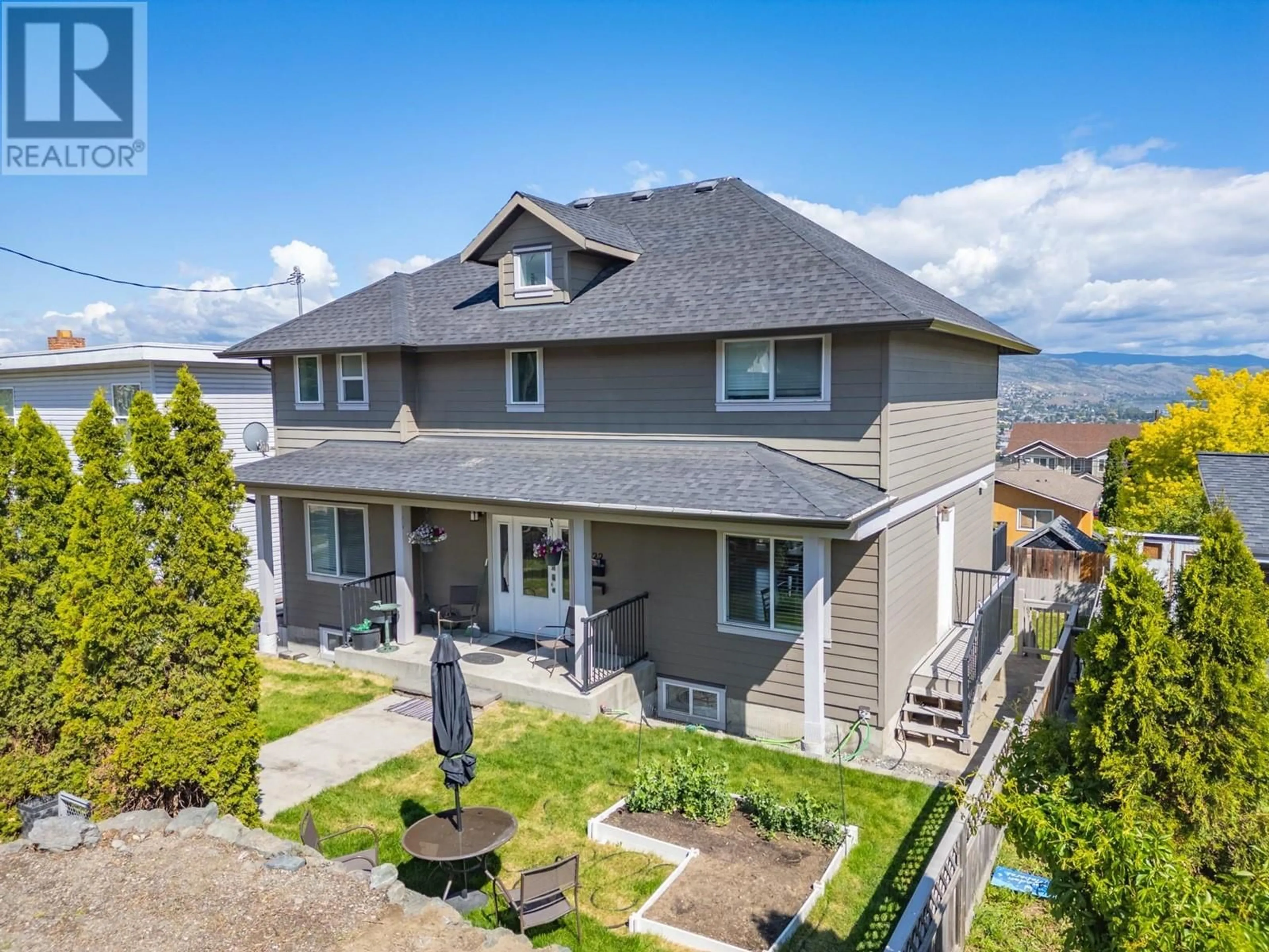 A pic from outside/outdoor area/front of a property/back of a property/a pic from drone, mountain view for 622 BATTLE  W STREET, Kamloops British Columbia V2C1H5