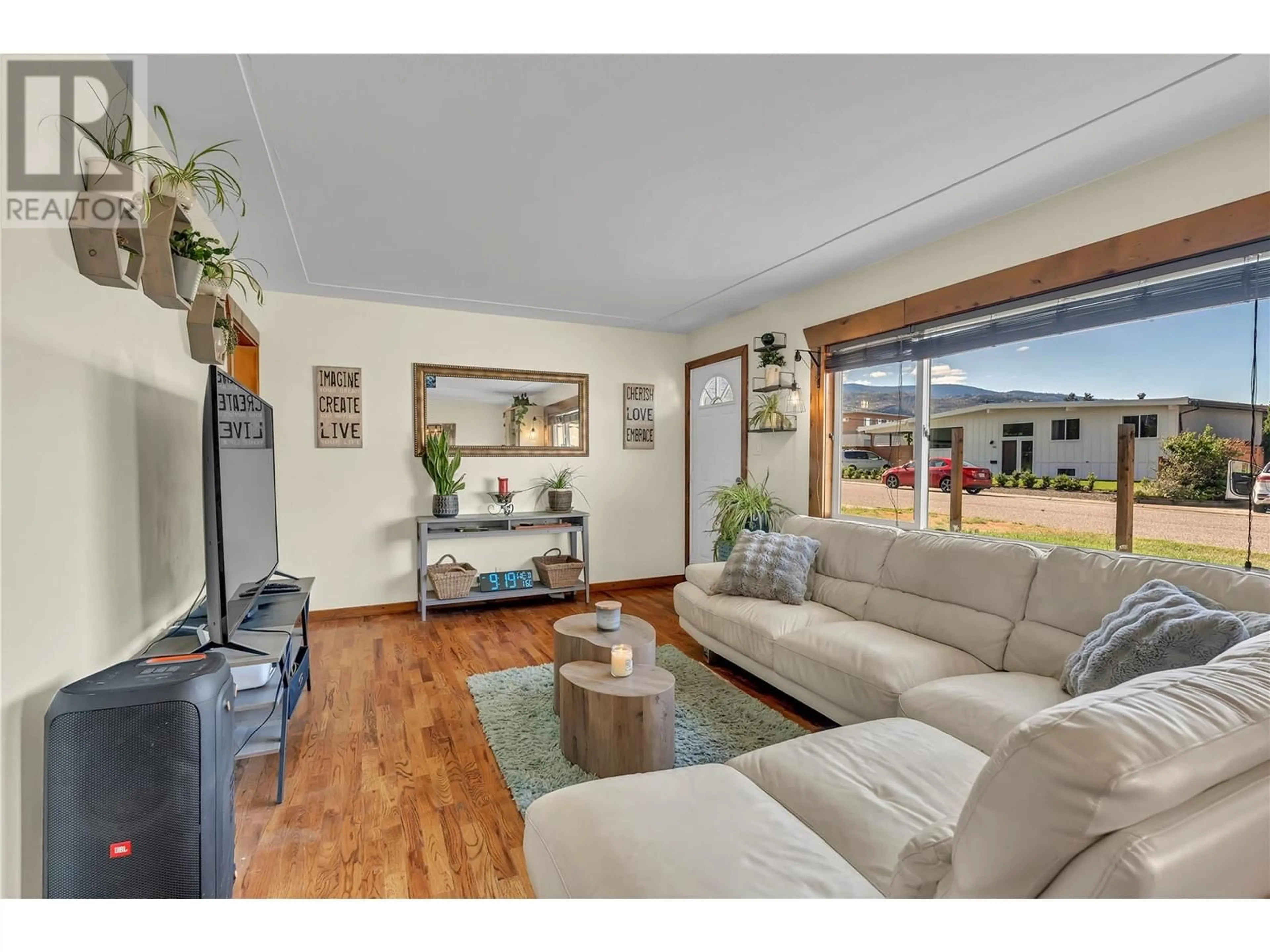 Living room with furniture, wood/laminate floor for 53 GRANBY PLACE, Penticton British Columbia V2A2Z3