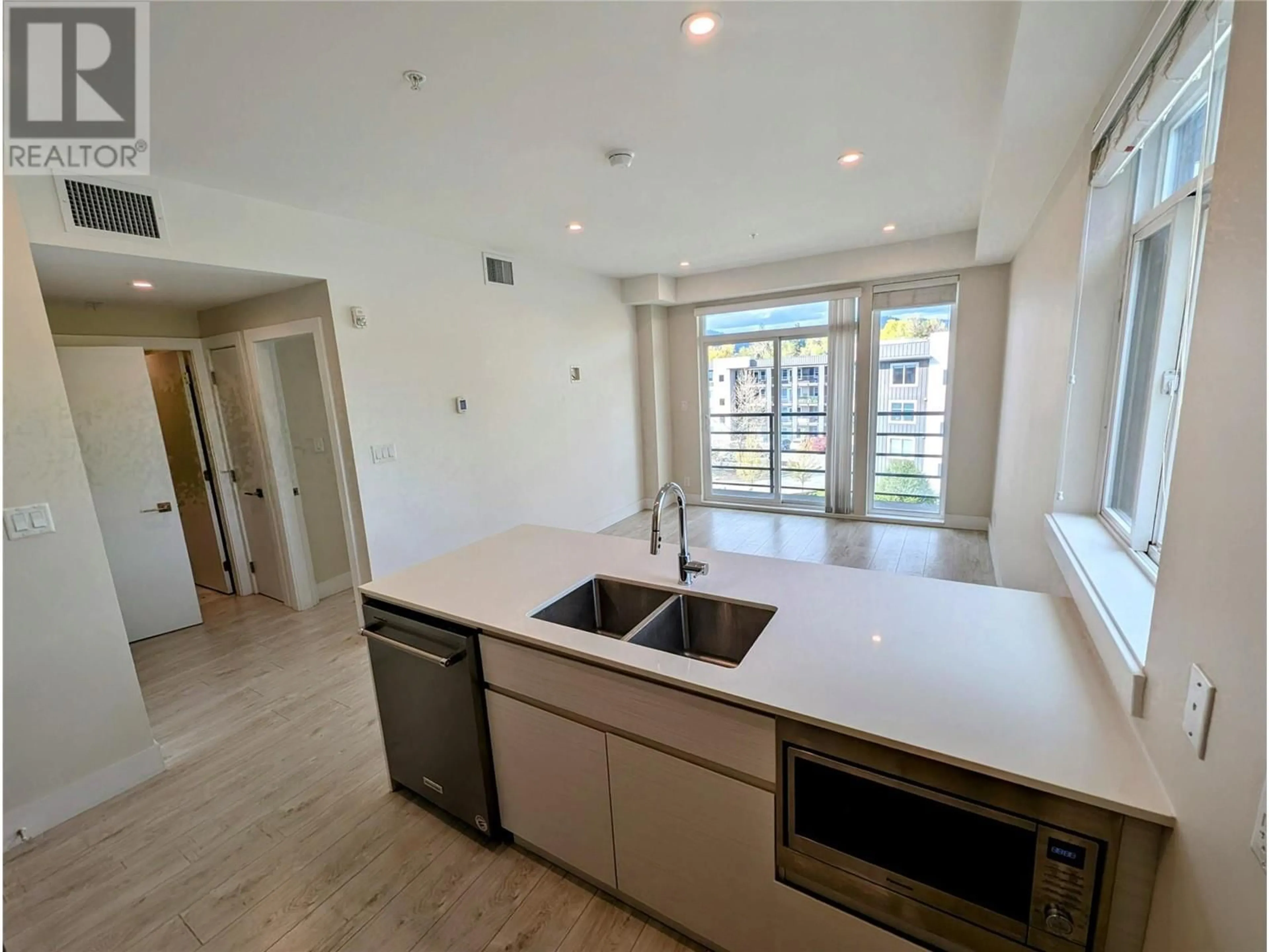 Open concept kitchen, unknown for 403 - 1925 ENTERPRISE WAY, Kelowna British Columbia V1Y4P7