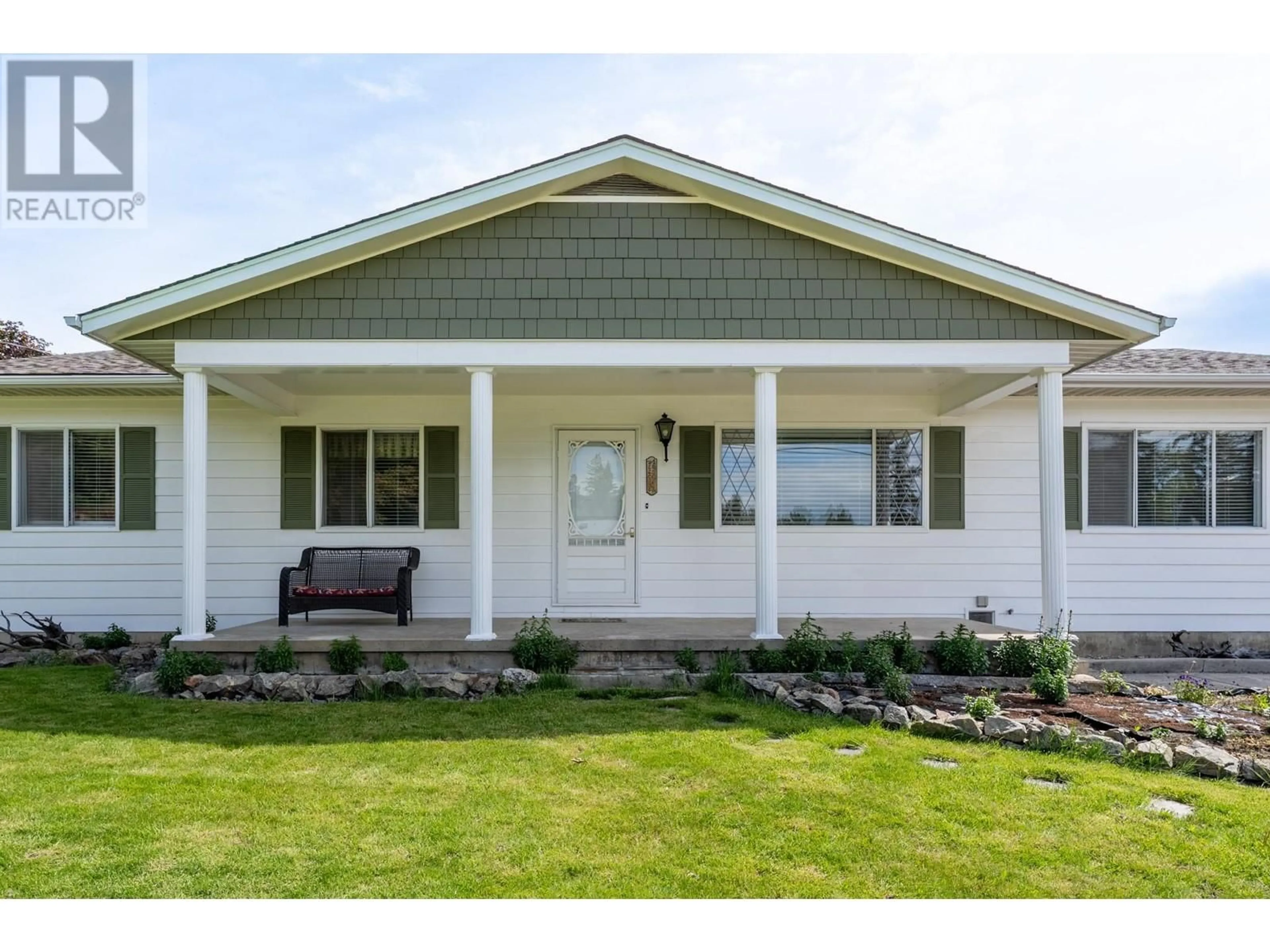 Home with vinyl exterior material, street for 9943 PARK LANE, Coldstream British Columbia V1B3E4
