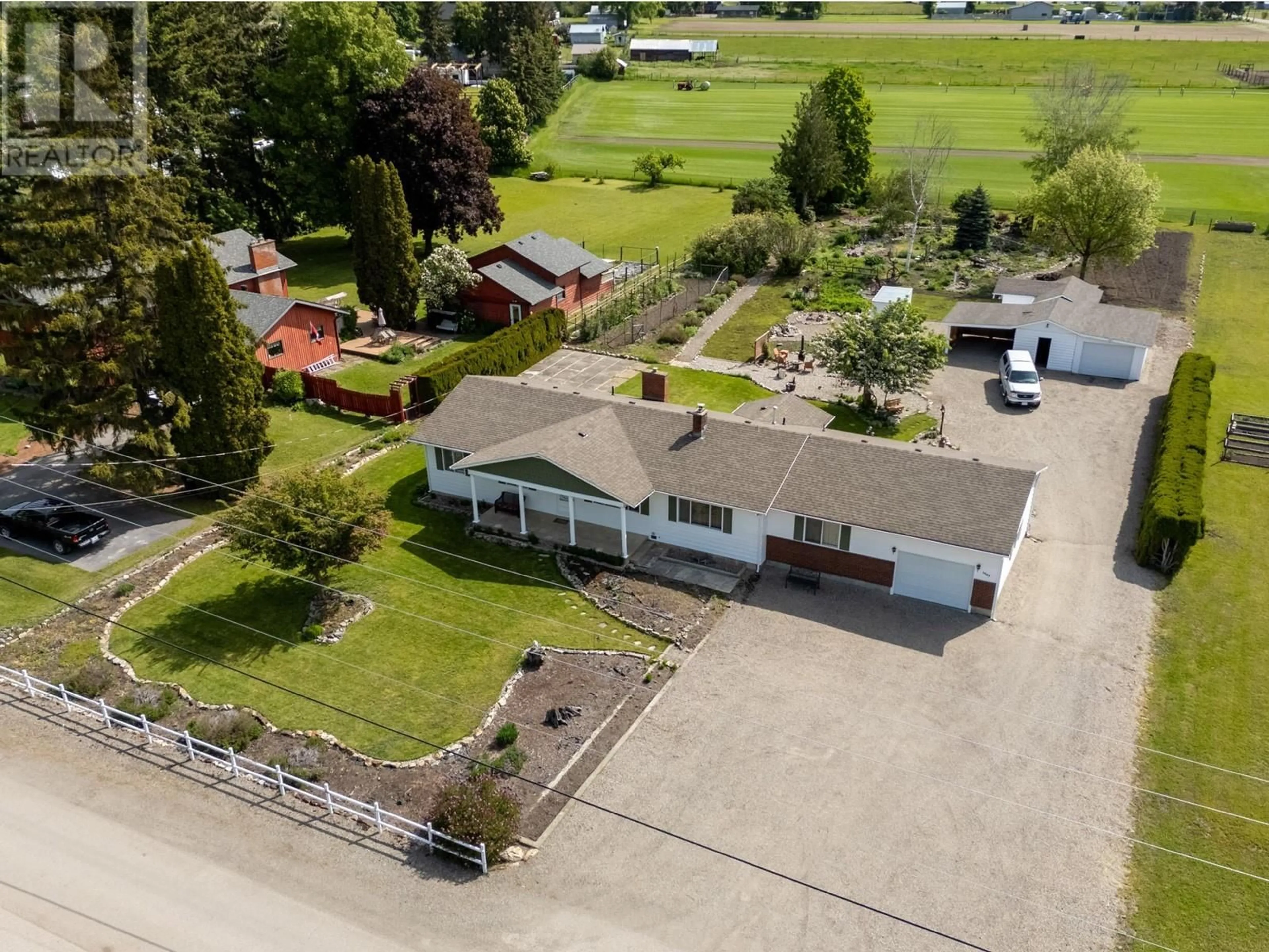 A pic from outside/outdoor area/front of a property/back of a property/a pic from drone, building for 9943 PARK LANE, Coldstream British Columbia V1B3E4
