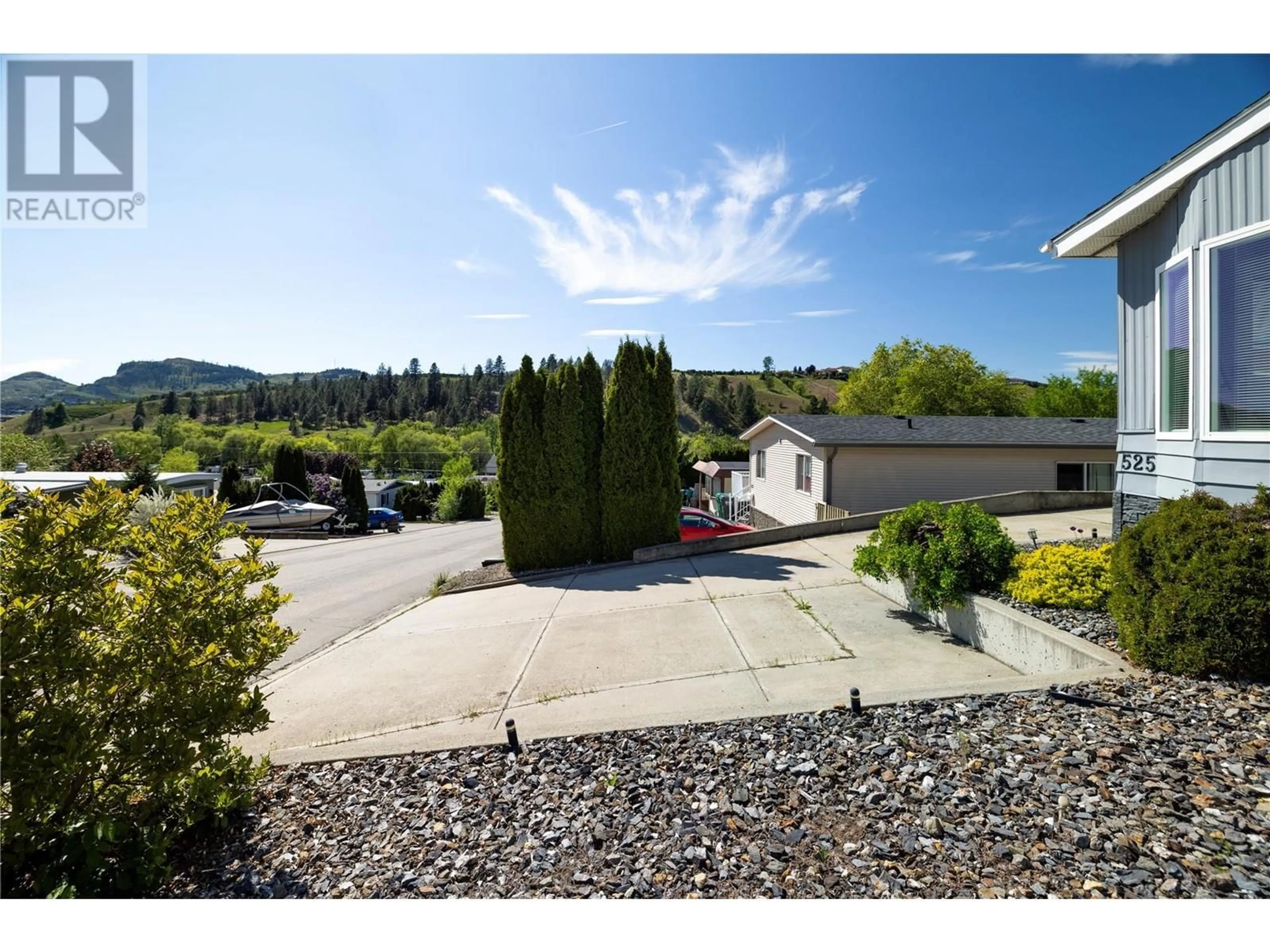 A pic from outside/outdoor area/front of a property/back of a property/a pic from drone, mountain view for 525 GUILDFORD COURT, Coldstream British Columbia V1B2E3