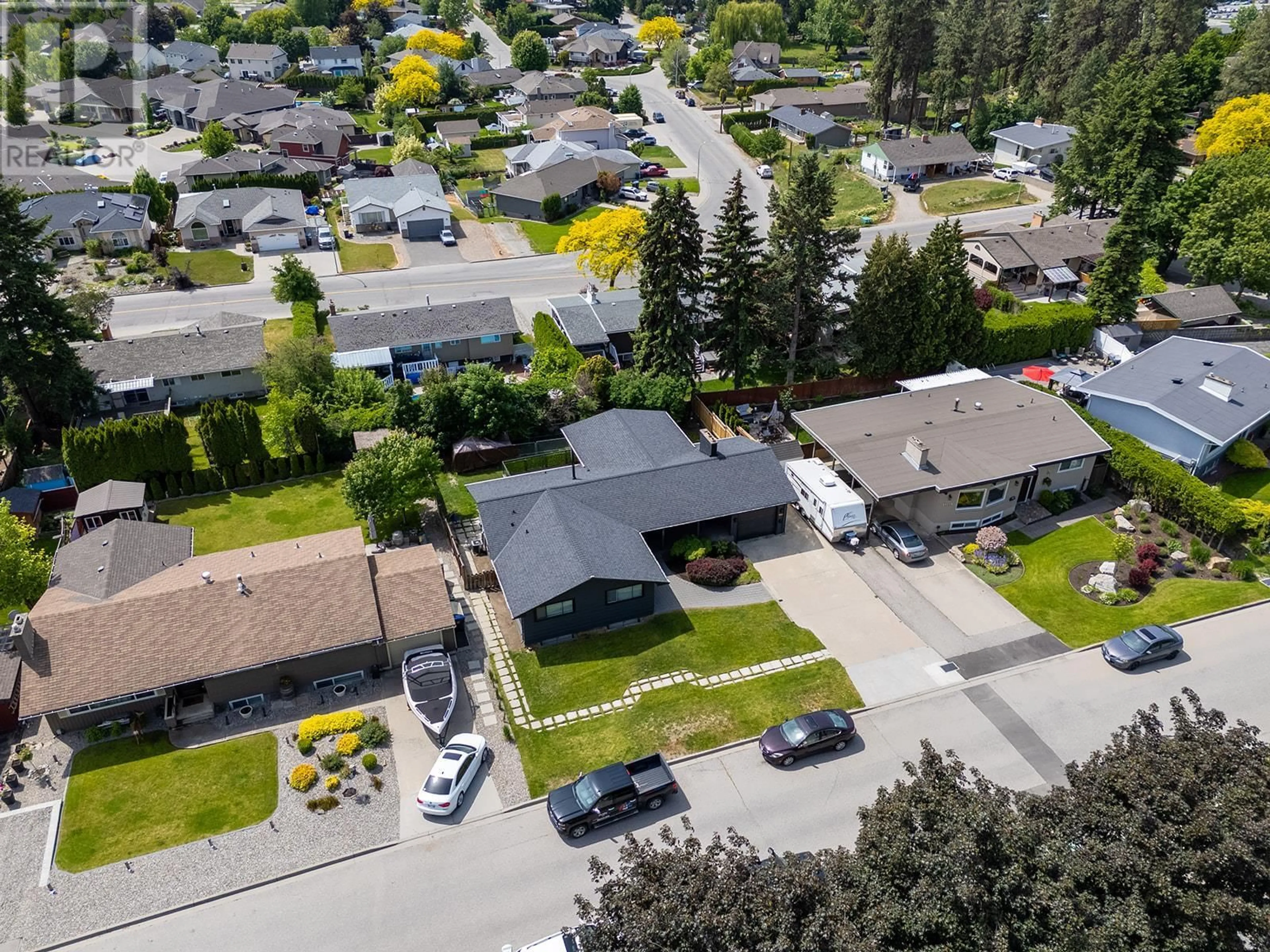 A pic from outside/outdoor area/front of a property/back of a property/a pic from drone, street for 1293 MONTEREY CRESCENT, Kelowna British Columbia V1Y3M6
