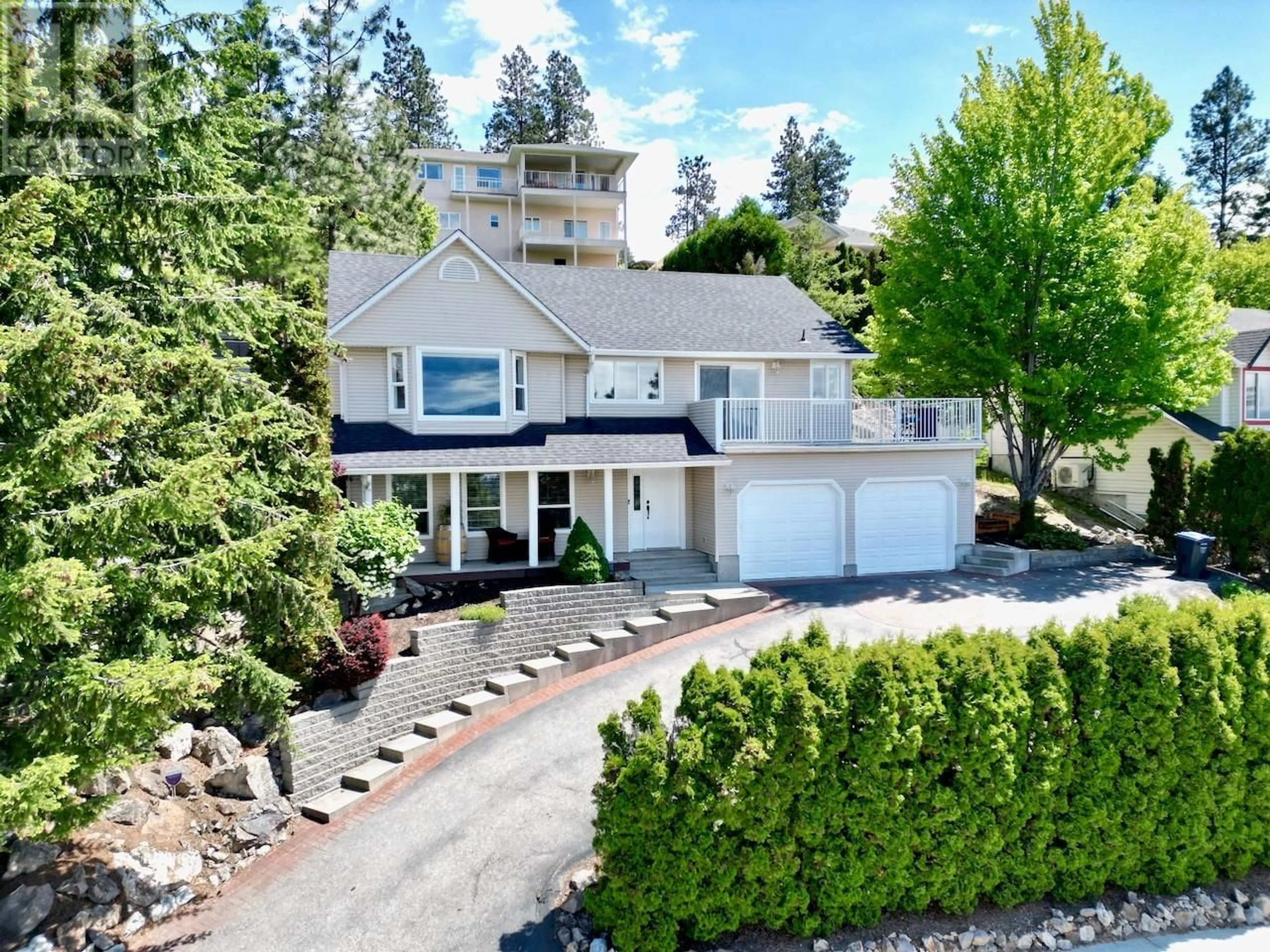 A pic from outside/outdoor area/front of a property/back of a property/a pic from drone, street for 1129 JAMES HOCKEY PLACE, Kelowna British Columbia V1X7L2
