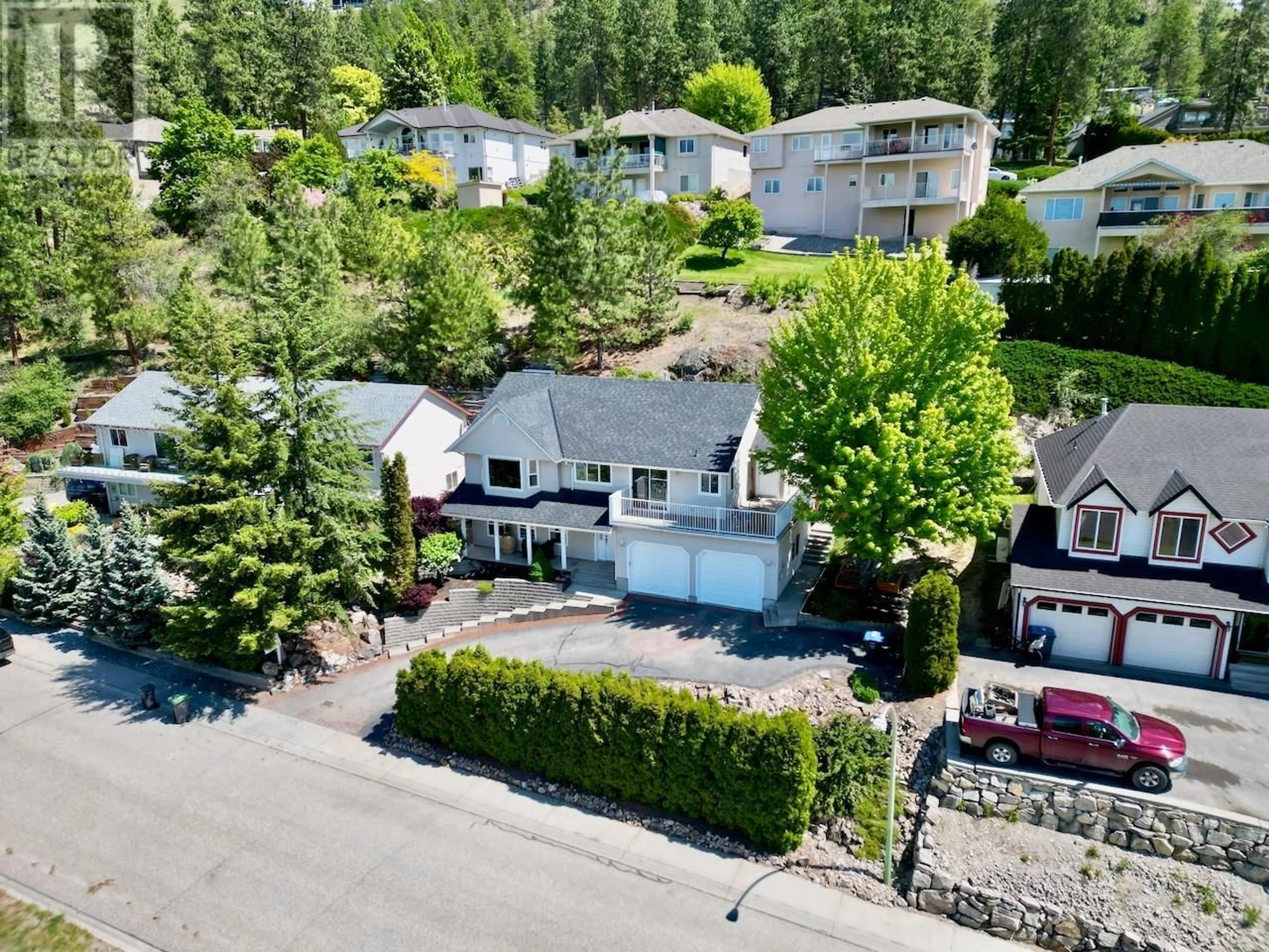 A pic from outside/outdoor area/front of a property/back of a property/a pic from drone, street for 1129 JAMES HOCKEY PLACE, Kelowna British Columbia V1X7L2