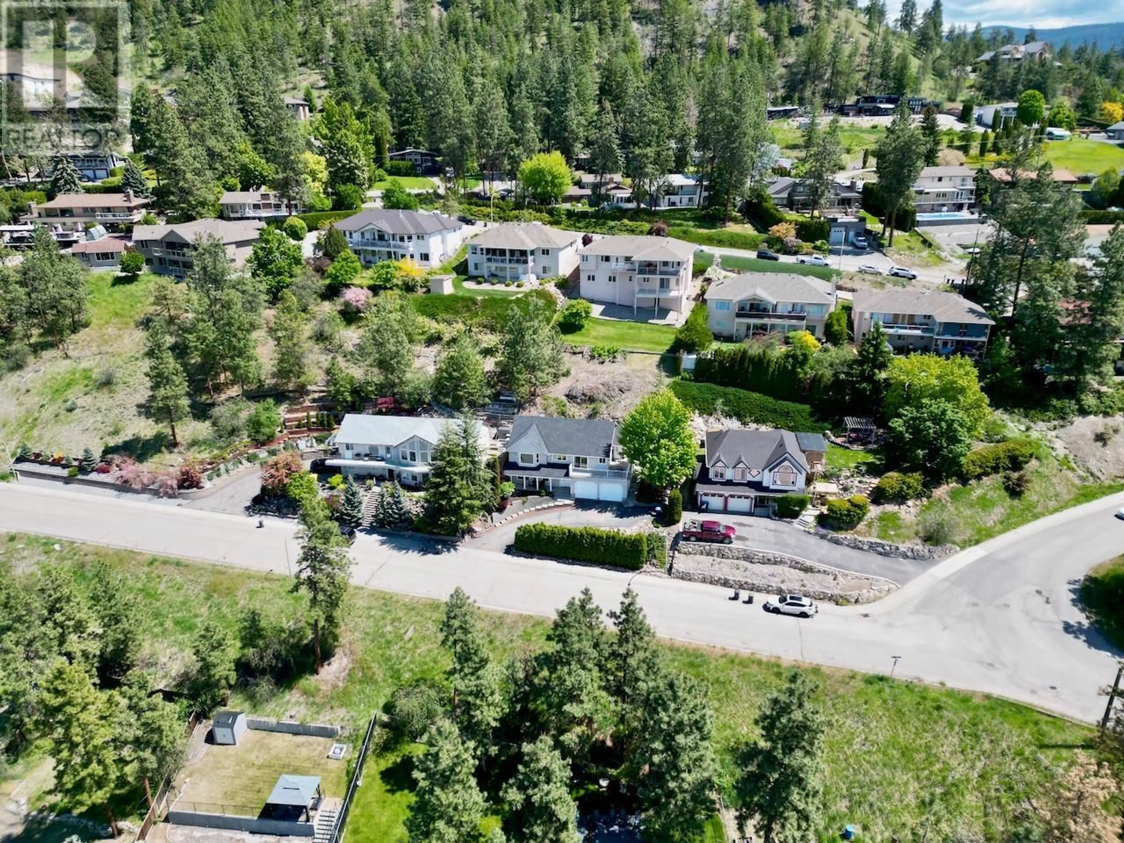 A pic from outside/outdoor area/front of a property/back of a property/a pic from drone, street for 1129 JAMES HOCKEY PLACE, Kelowna British Columbia V1X7L2
