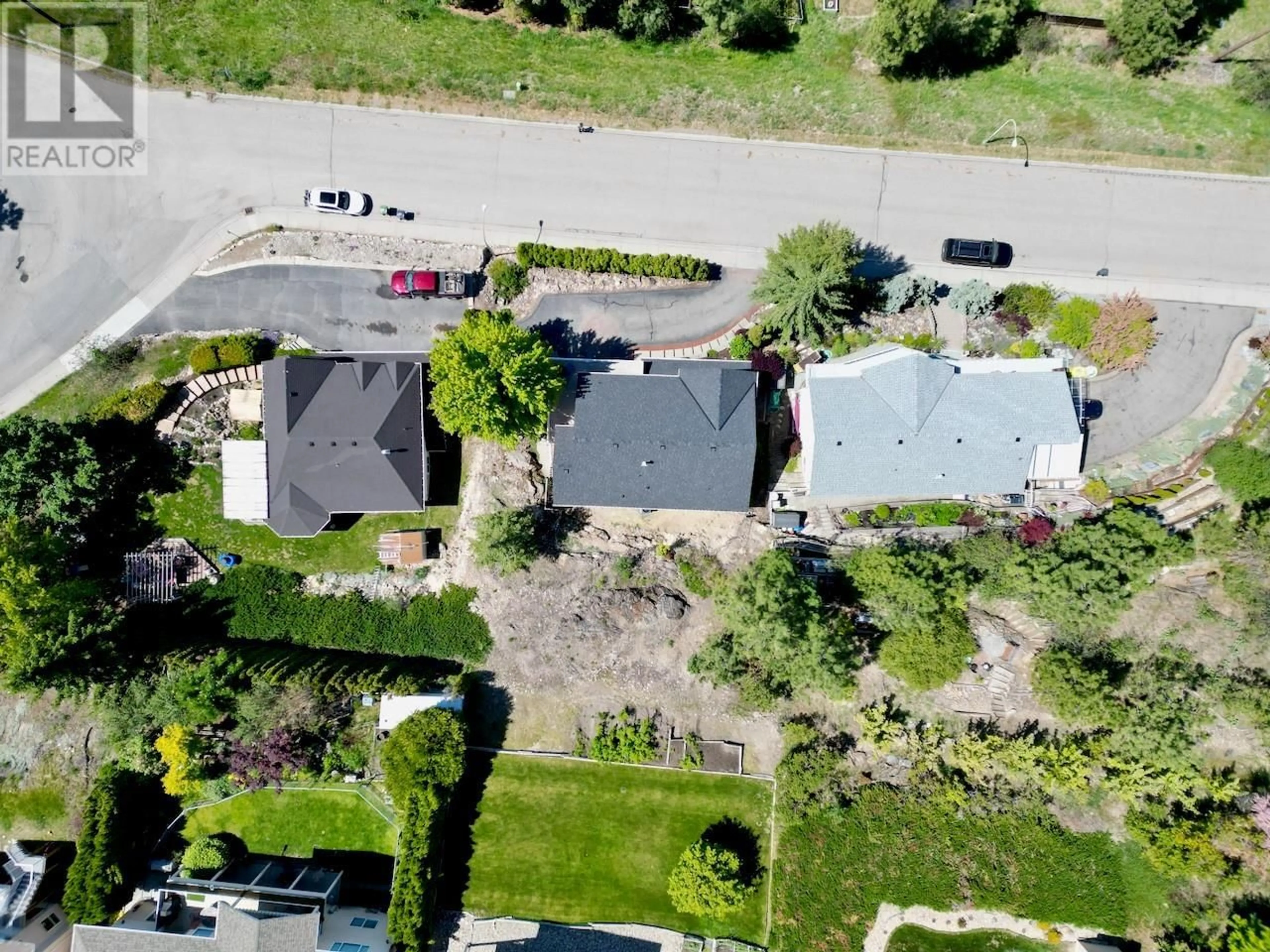 A pic from outside/outdoor area/front of a property/back of a property/a pic from drone, street for 1129 JAMES HOCKEY PLACE, Kelowna British Columbia V1X7L2