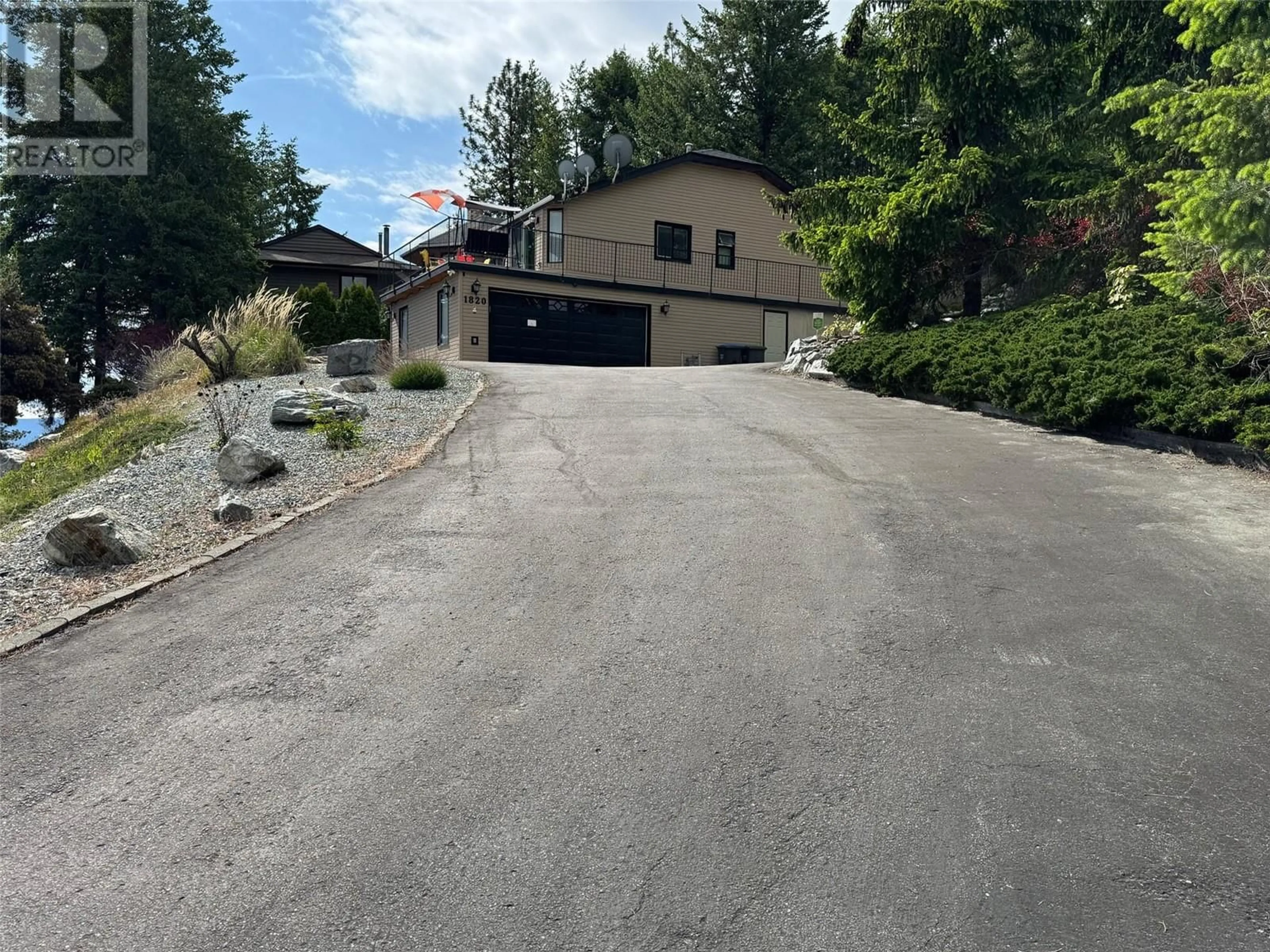 A pic from outside/outdoor area/front of a property/back of a property/a pic from drone, street for 1820 OLYMPUS WAY, West Kelowna British Columbia V1Z3J1