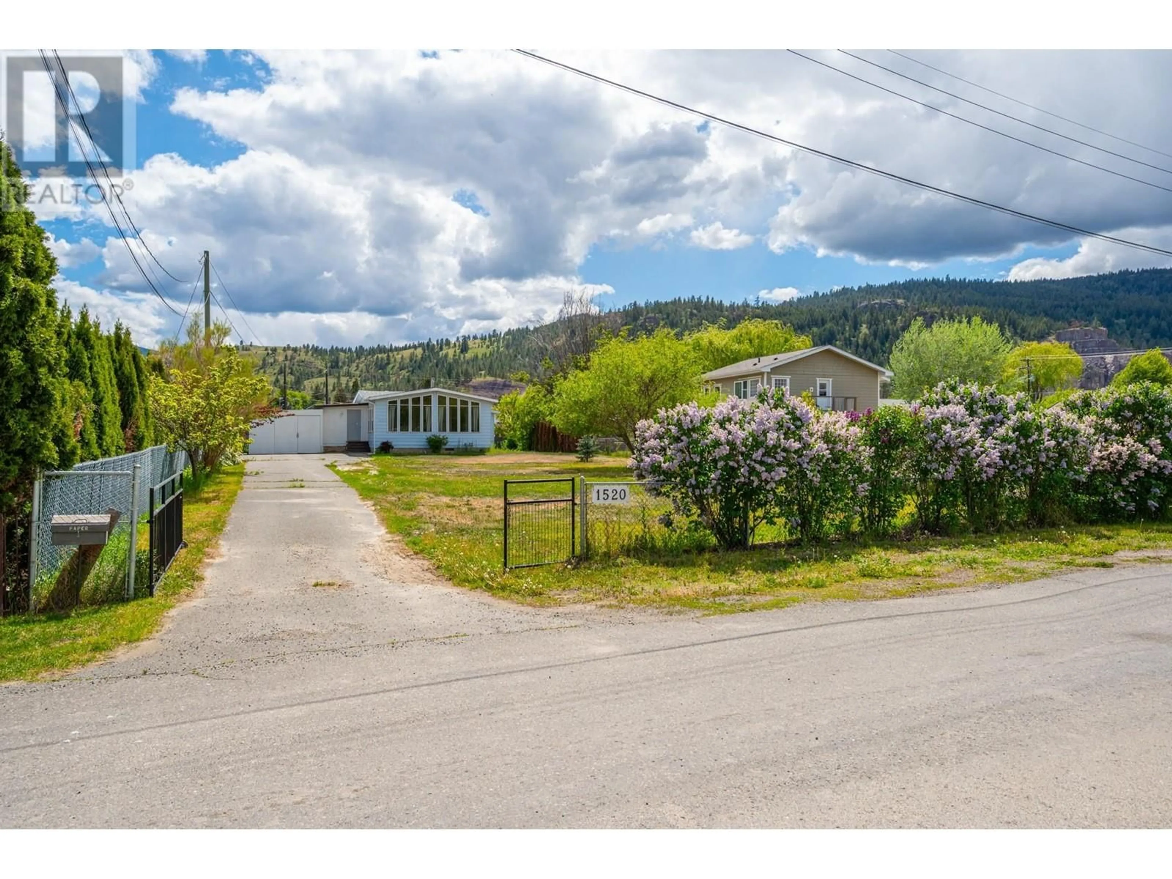 A pic from outside/outdoor area/front of a property/back of a property/a pic from drone, street for 1520 WILLIAMS CRESCENT, Merritt British Columbia V1K1K9