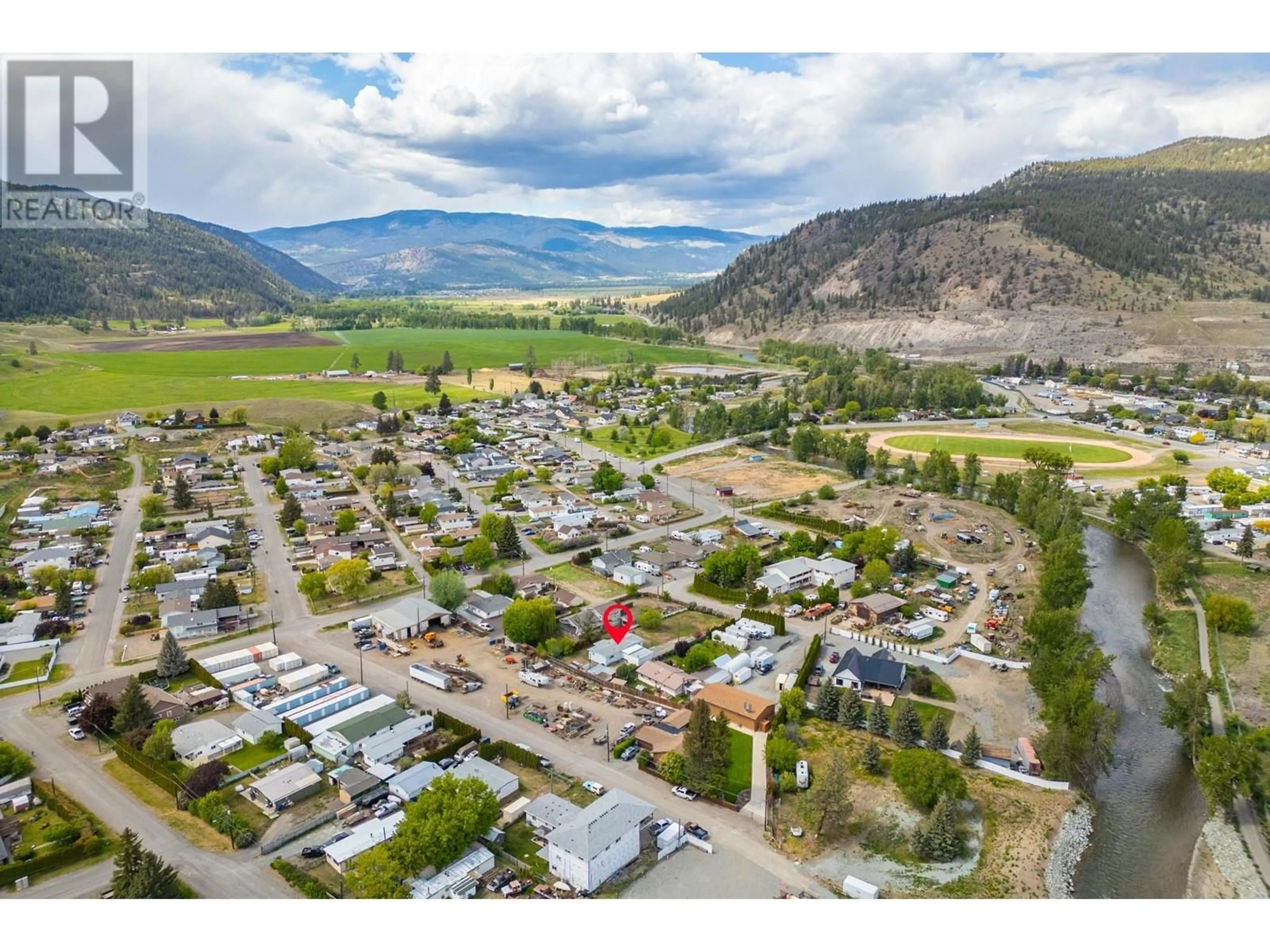 A pic from outside/outdoor area/front of a property/back of a property/a pic from drone, mountain view for 1520 WILLIAMS CRESCENT, Merritt British Columbia V1K1K9