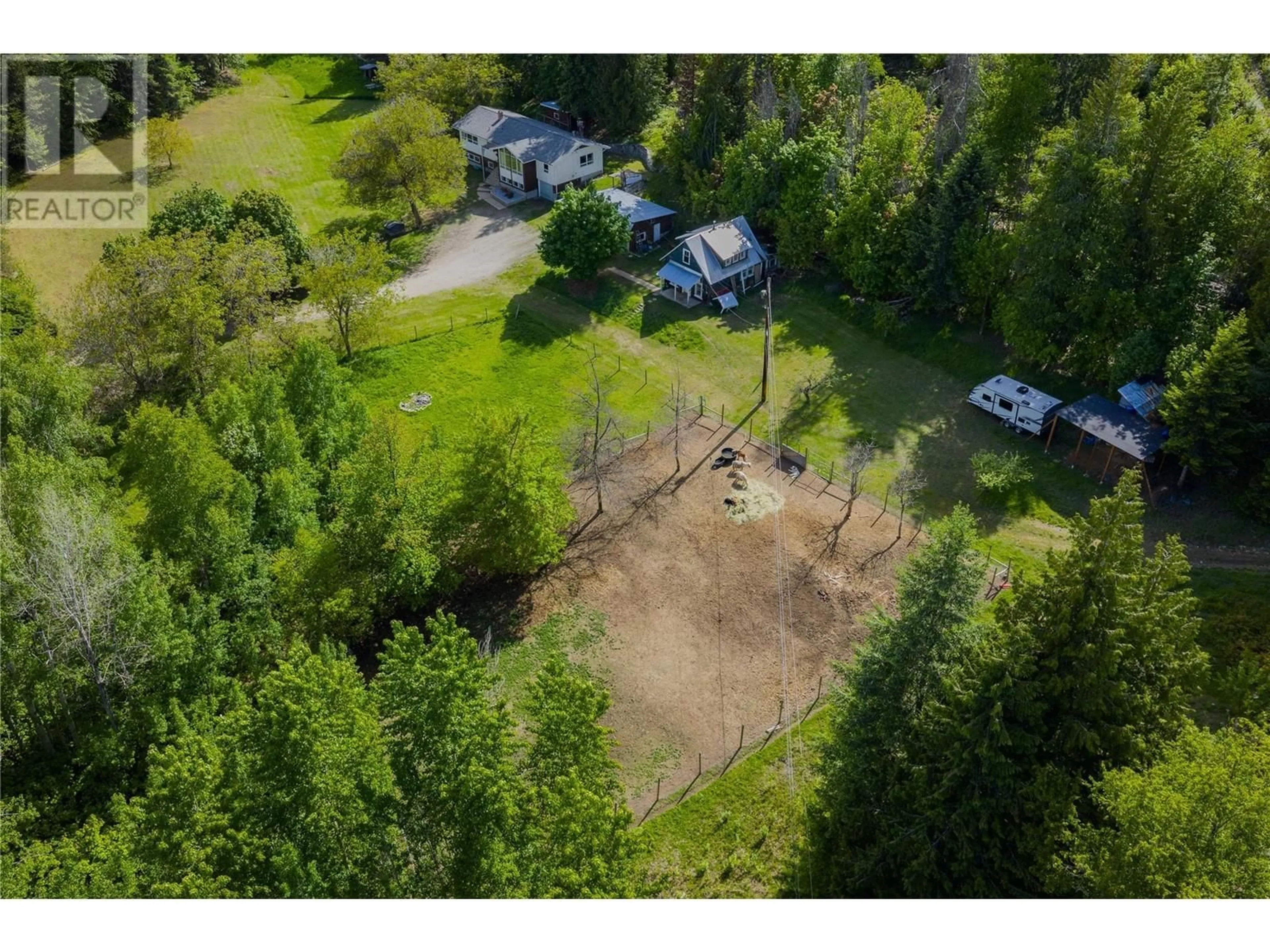 A pic from outside/outdoor area/front of a property/back of a property/a pic from drone, forest/trees view for 1 MASON ROAD, Castlegar British Columbia V1N3Z1