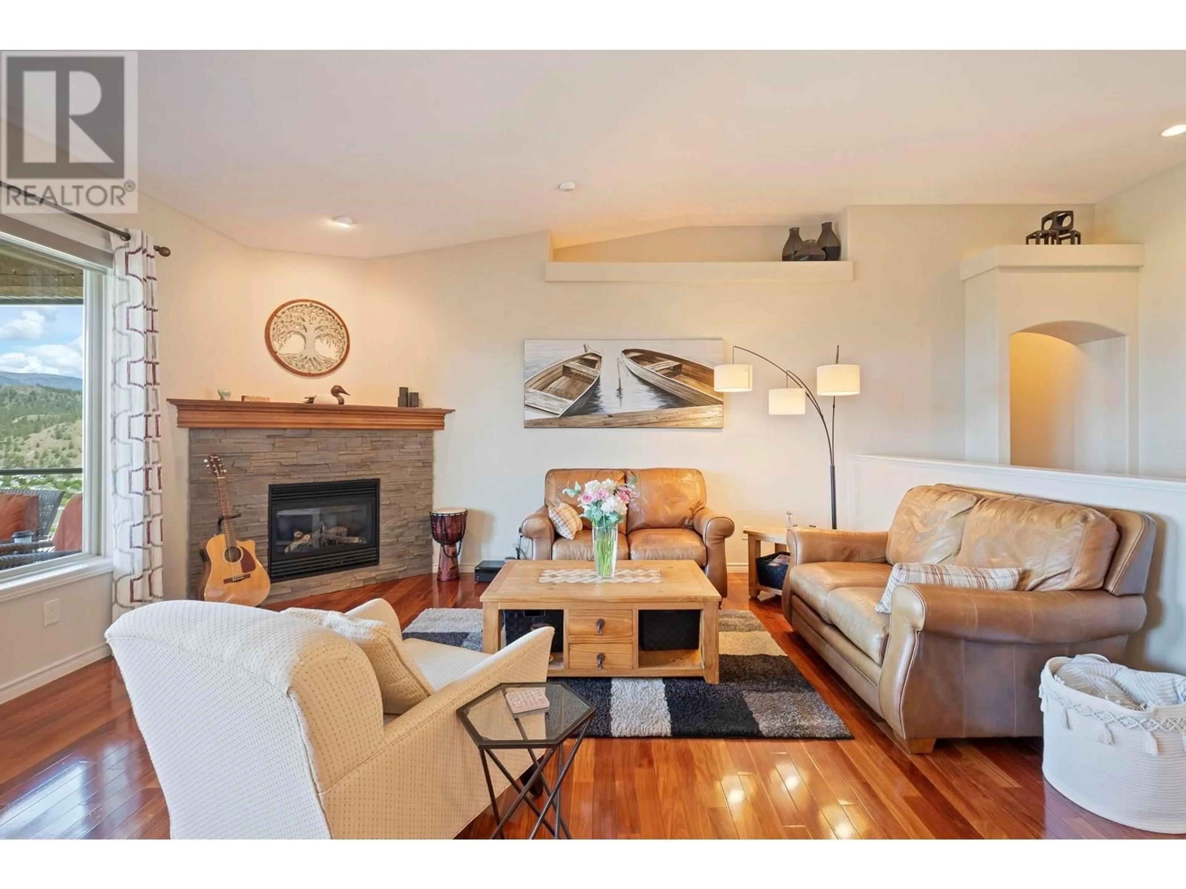 Living room with furniture, wood/laminate floor for 329 - 663 DENALI COURT, Kelowna British Columbia V1V2R4