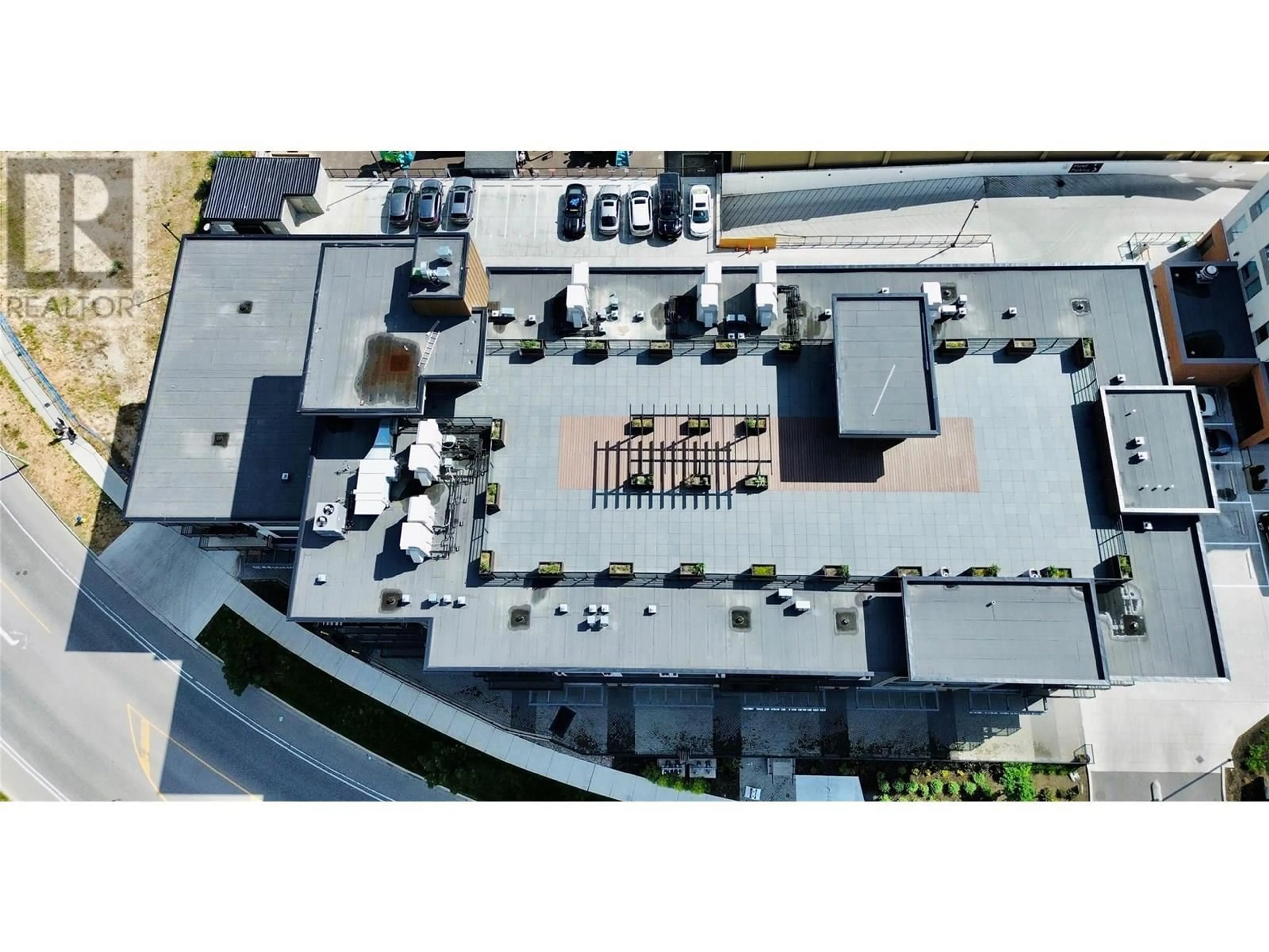 A pic from outside/outdoor area/front of a property/back of a property/a pic from drone, building for 305 - 1925 ENTERPRISE WAY, Kelowna British Columbia V1Y9S9