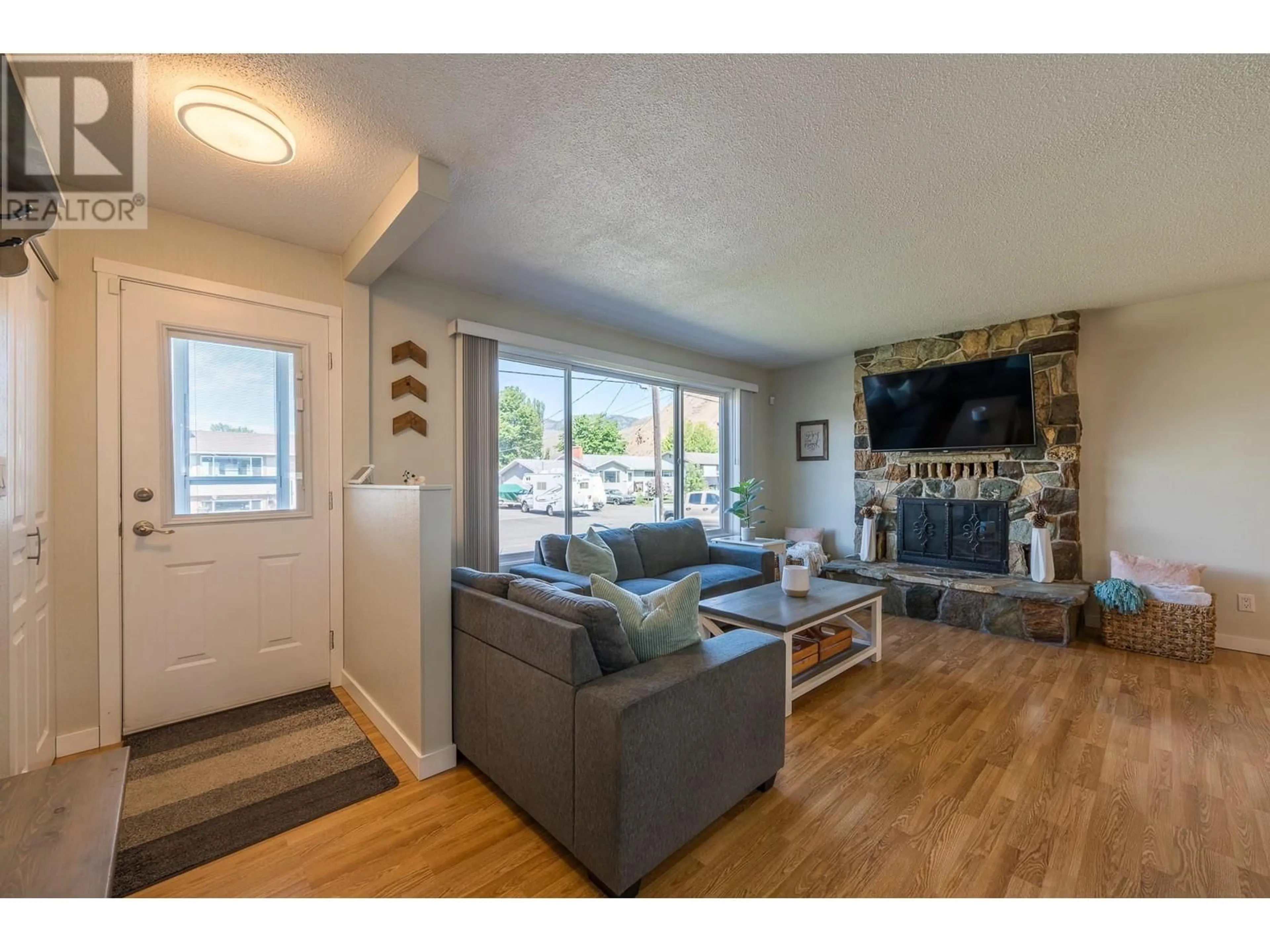 Living room with furniture, wood/laminate floor for 1139 CHATEAU STREET, Kamloops British Columbia V2B5R3