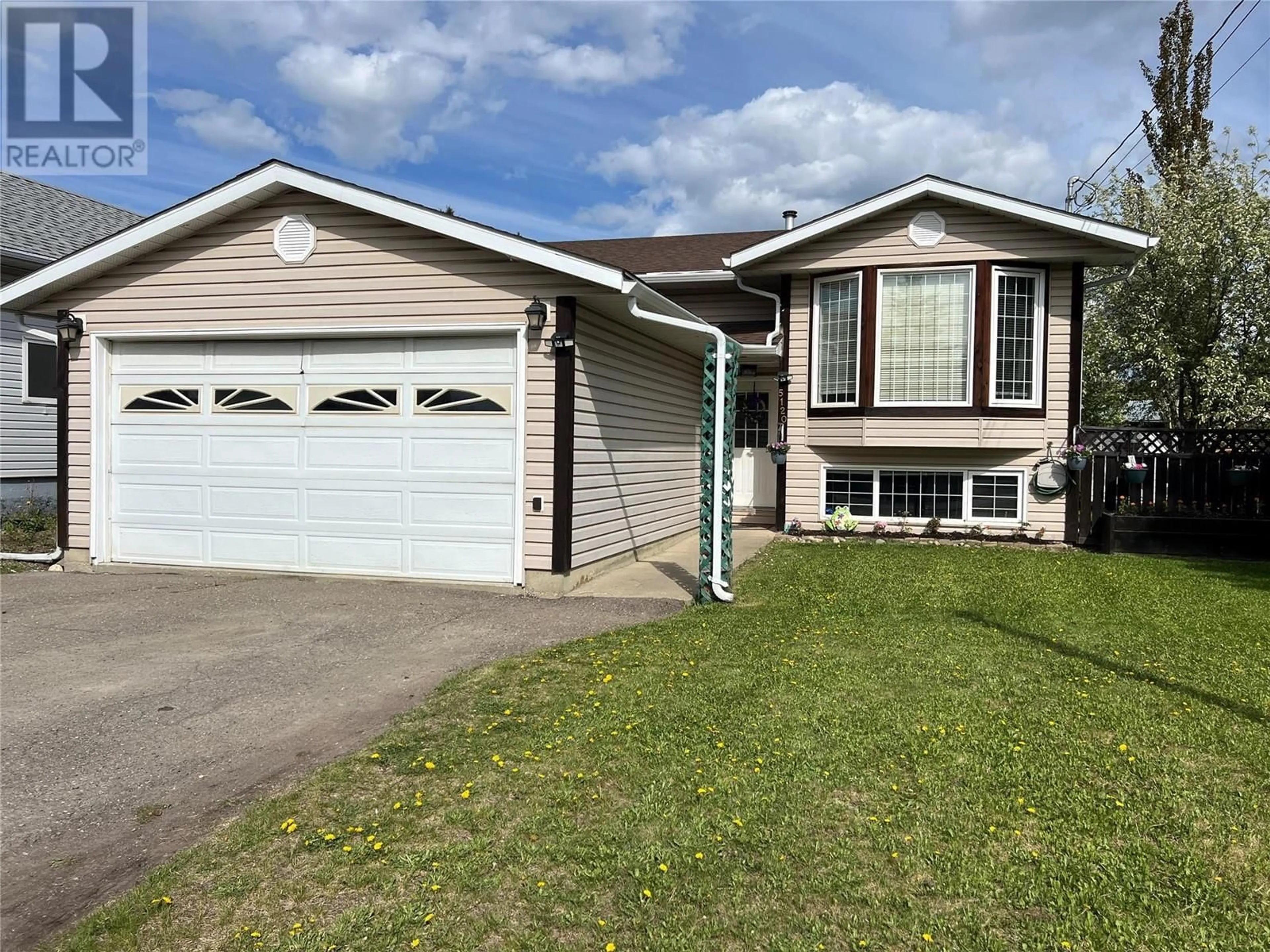 Home with vinyl exterior material, street for 5120 41 STREET NORTHEAST, Chetwynd British Columbia V0C1J0