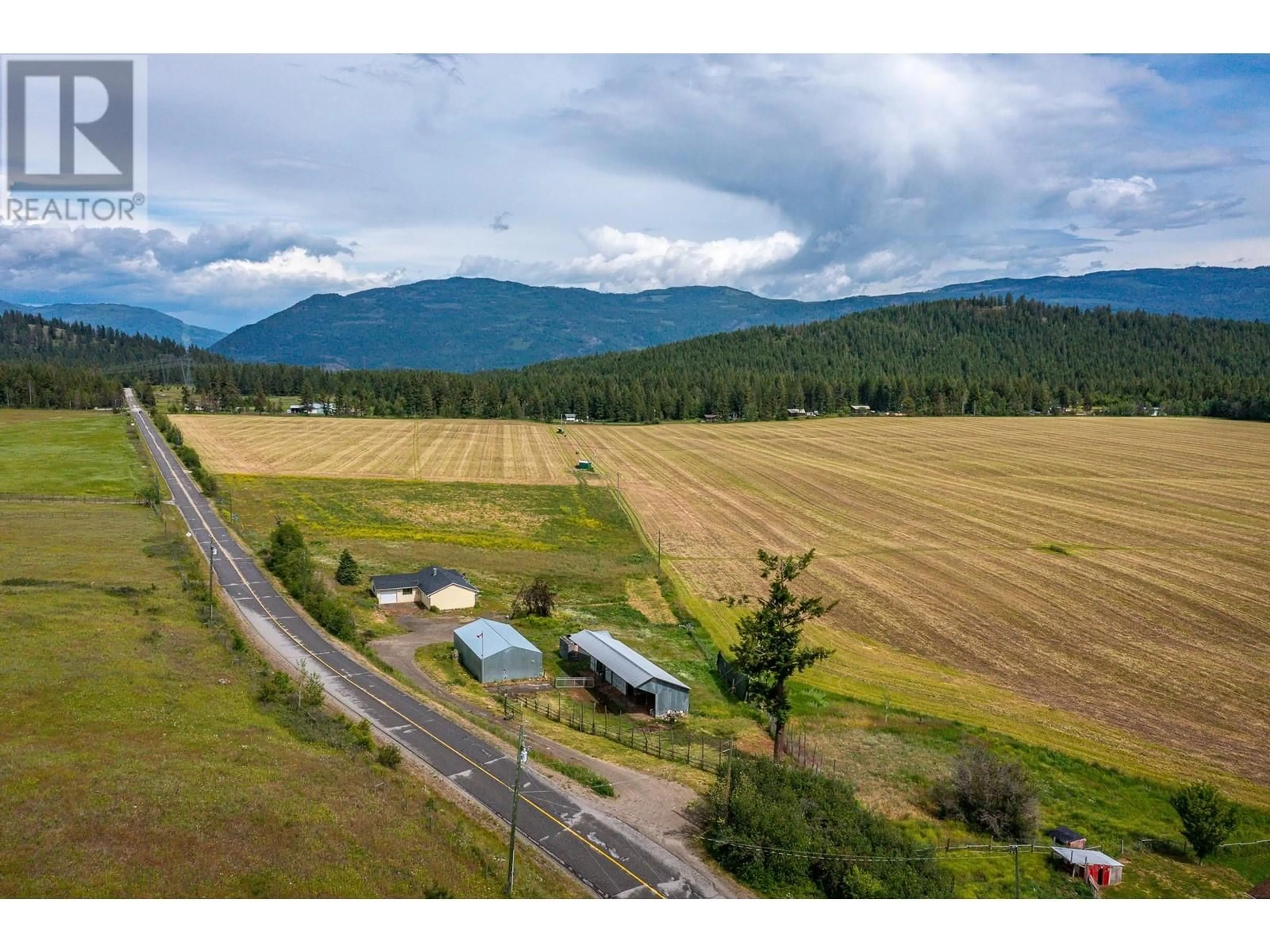 A pic from outside/outdoor area/front of a property/back of a property/a pic from drone, mountain view for 3575 CANYON ROAD, Spallumcheen British Columbia V4Y0M7